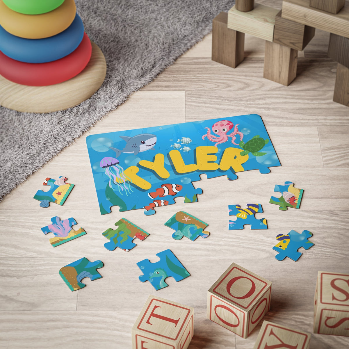 Personalized ocean-themed kids puzzle being assembled on the floor, showing bright sea animals and a custom name, designed as an educational 30-piece jigsaw for young children