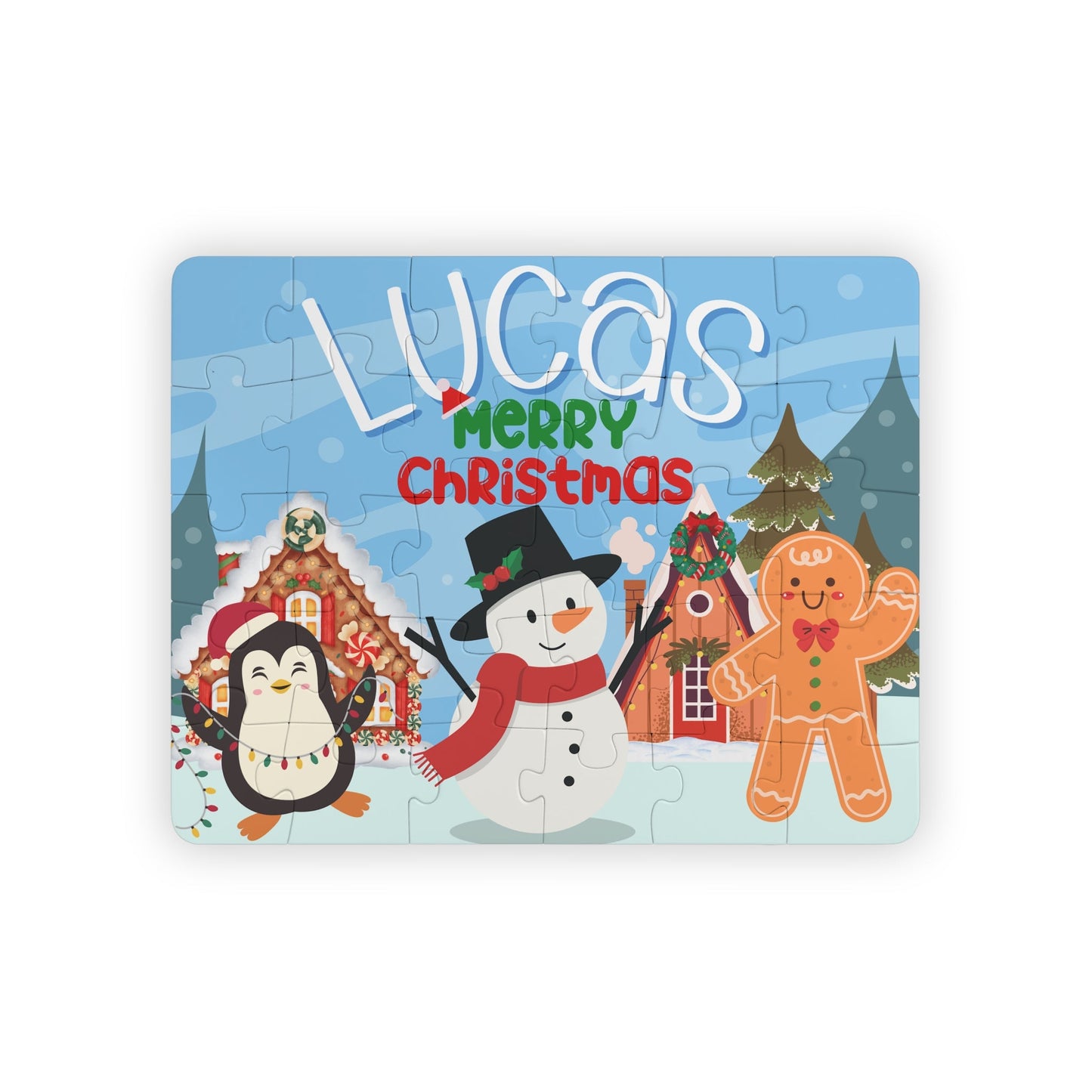 Personalized kids Christmas jigsaw puzzle featuring a winter holiday village scene with a snowman, penguin, and gingerbread character, showing a customizable name placed prominently across the top of the puzzle.