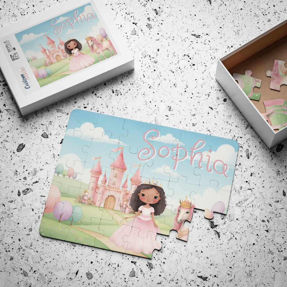Custom name princess puzzle with matching storage box, showing the personalized name printed at the top of the castle design on a 30-piece jigsaw puzzle