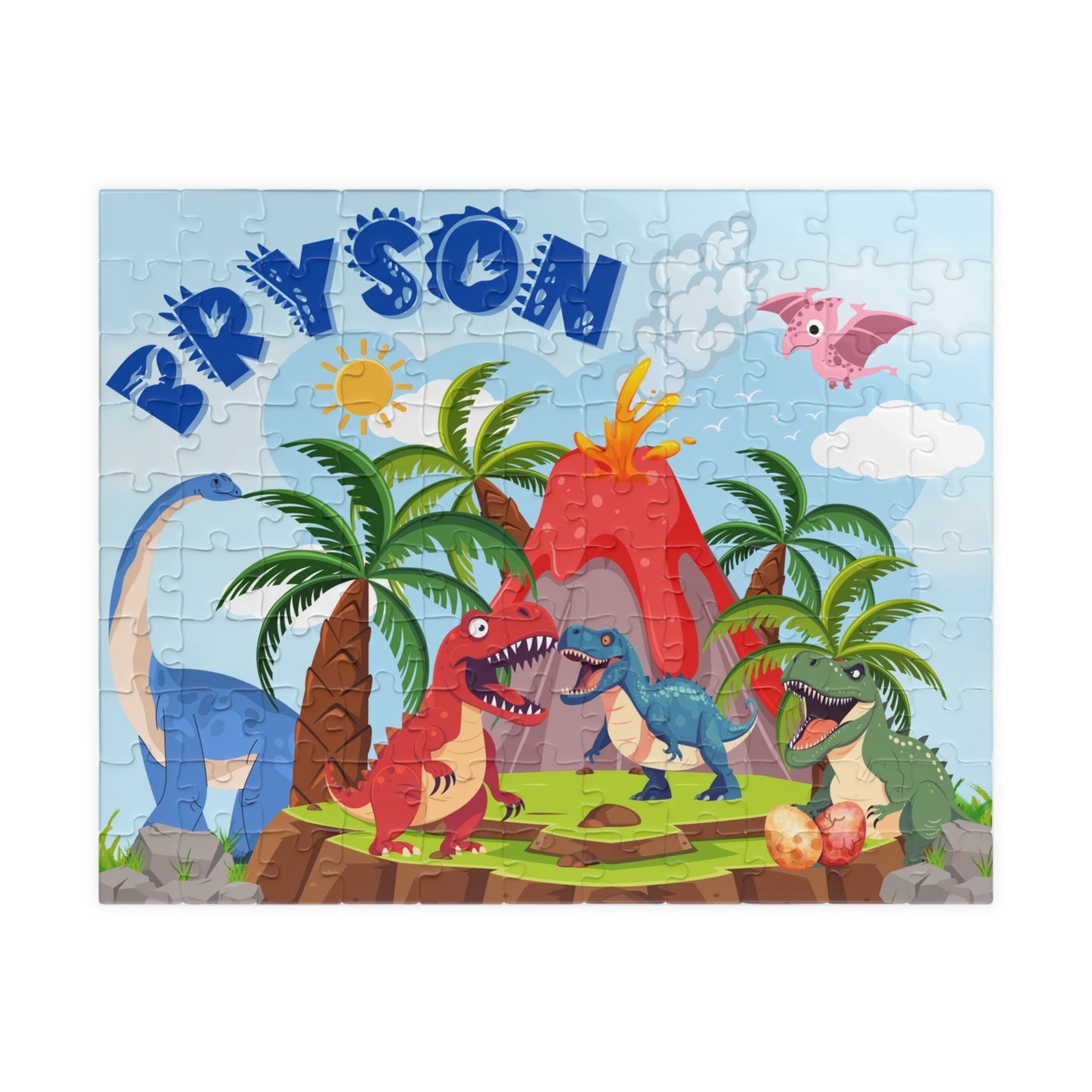 Personalized dinosaur name puzzle for kids featuring a colorful Jurassic volcano scene with multiple cartoon dinosaurs, palm trees, and a smoking volcano. The child’s name “Bryson” appears in large blue letters across the top, showing where the custom name is placed on this 110-piece jigsaw puzzle.