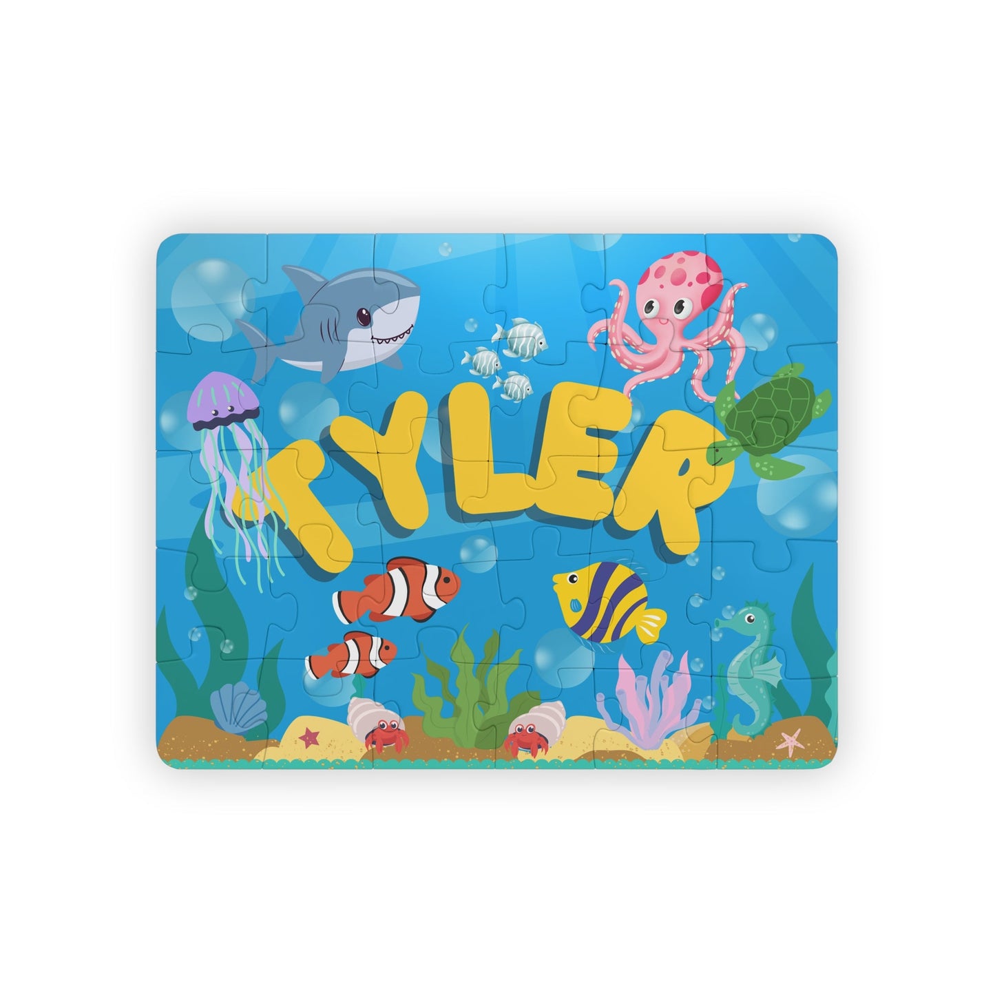 Personalized 30-piece ocean puzzle for kids featuring colorful underwater animals like sharks, octopus, jellyfish, fish, and turtles, with the child’s name displayed in large letters across the center