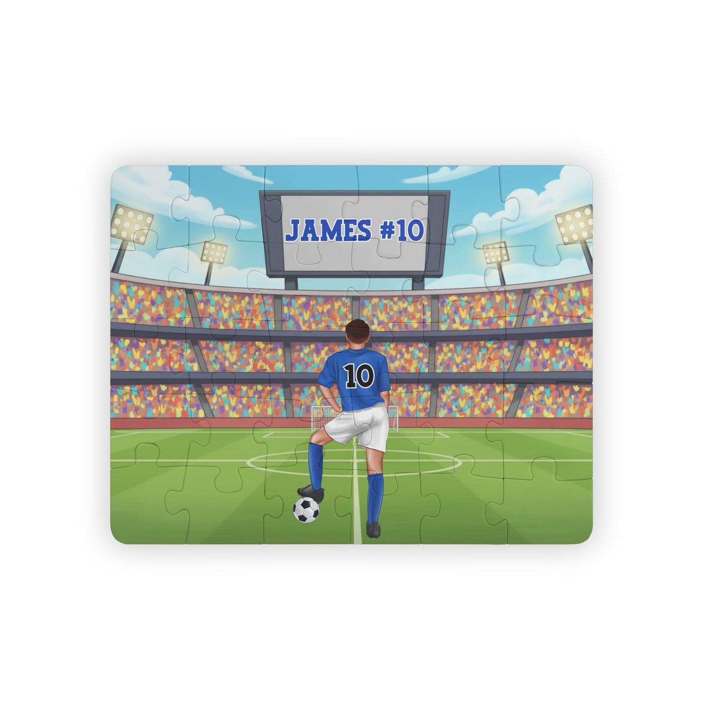 Personalized boys soccer jigsaw puzzle showing a player standing on a stadium field, with a customizable name displayed on the scoreboard and a customizable number on the back of the jersey.