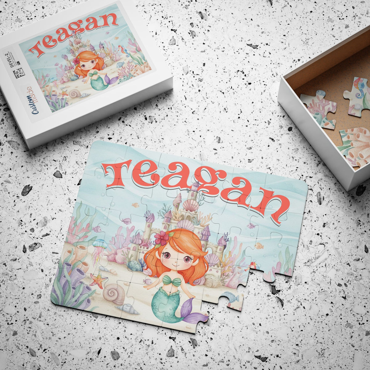 Custom name mermaid jigsaw puzzle for kids shown with gift box packaging, featuring an under the sea castle scene with pastel ocean animals