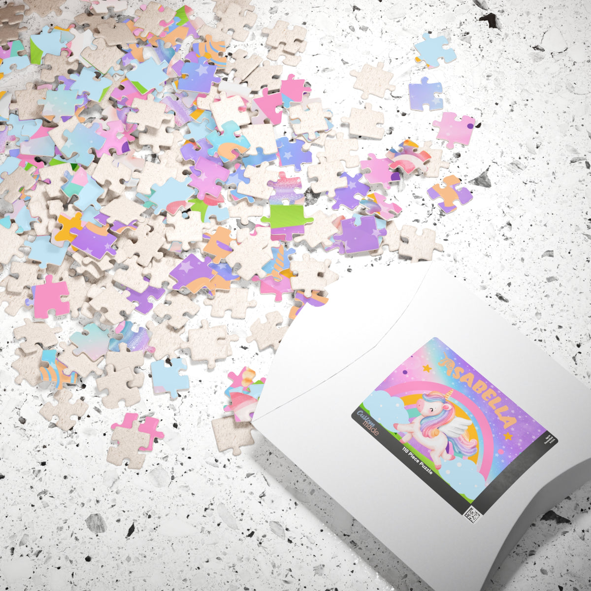 Personalized unicorn puzzle shown with packaged in a box and scattered puzzle pieces with the customizable child’s name
