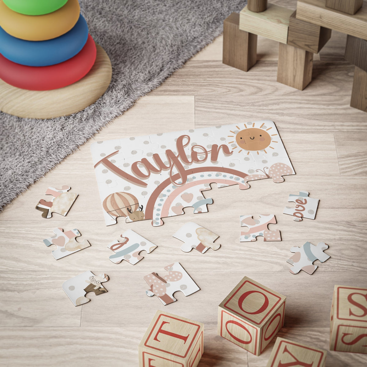 Personalized kids name puzzle with a soft boho rainbow illustration, featuring large 30-piece jigsaw pieces and a customizable name printed prominently on the puzzle.