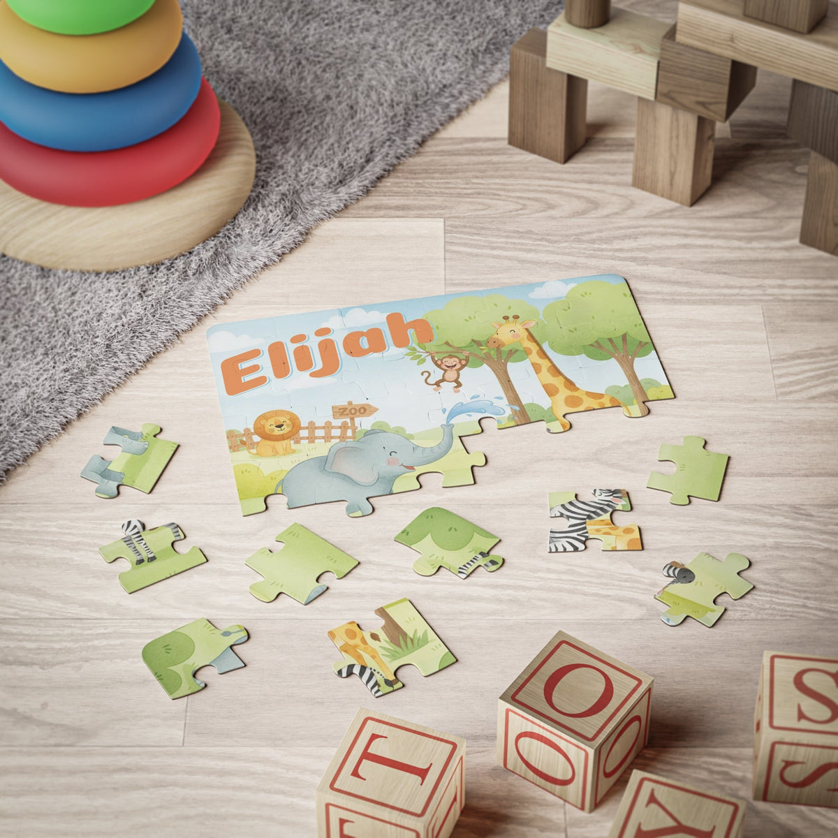 Personalized zoo animal jigsaw puzzle with a customizable name displayed at the top, shown being played with on a child’s playroom floor