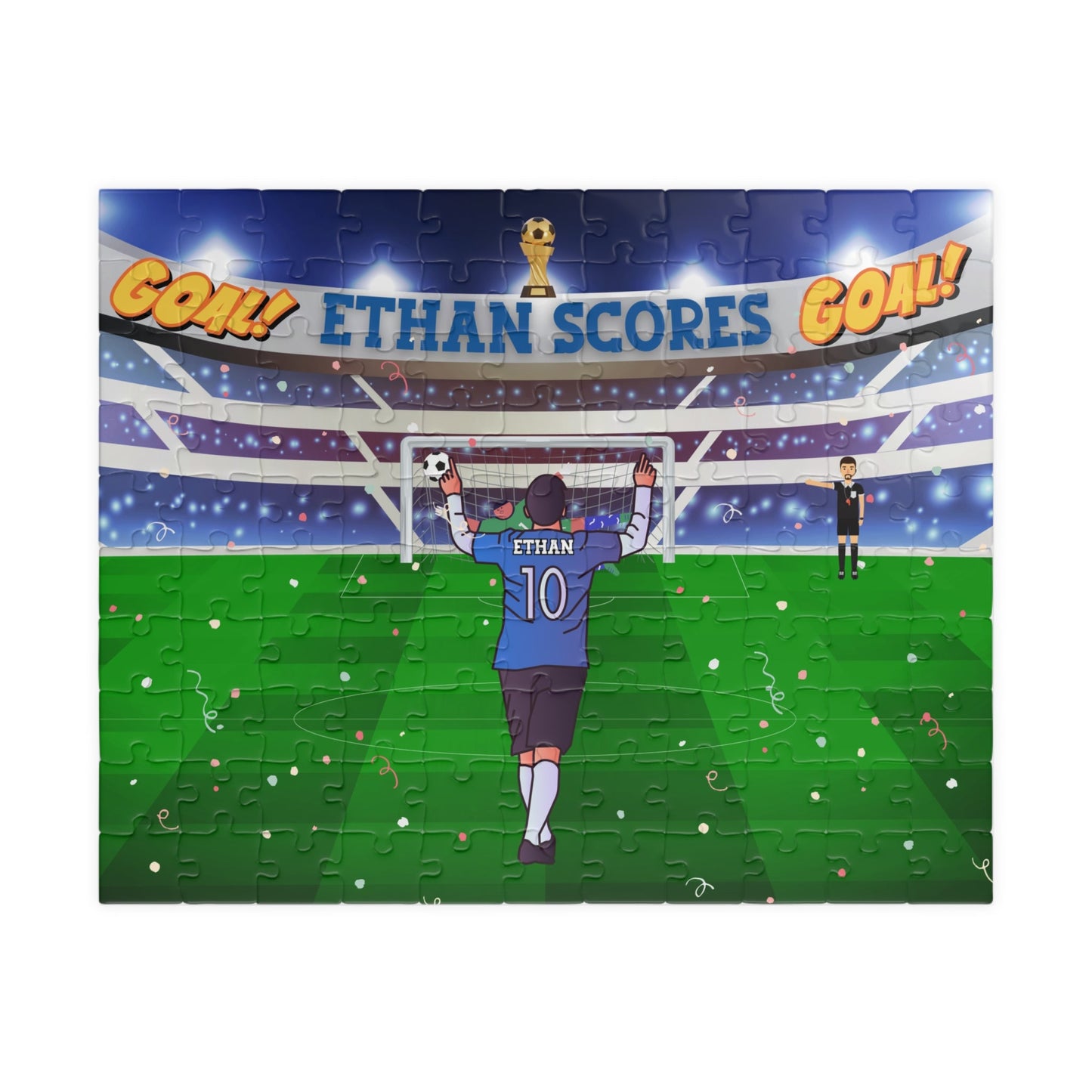 Personalized 110-piece kids soccer puzzle showing a child celebrating a goal in a packed stadium, wearing a blue jersey with a customizable name on the back, confetti in the air, and a scoreboard banner reading “GOAL” above the field.
