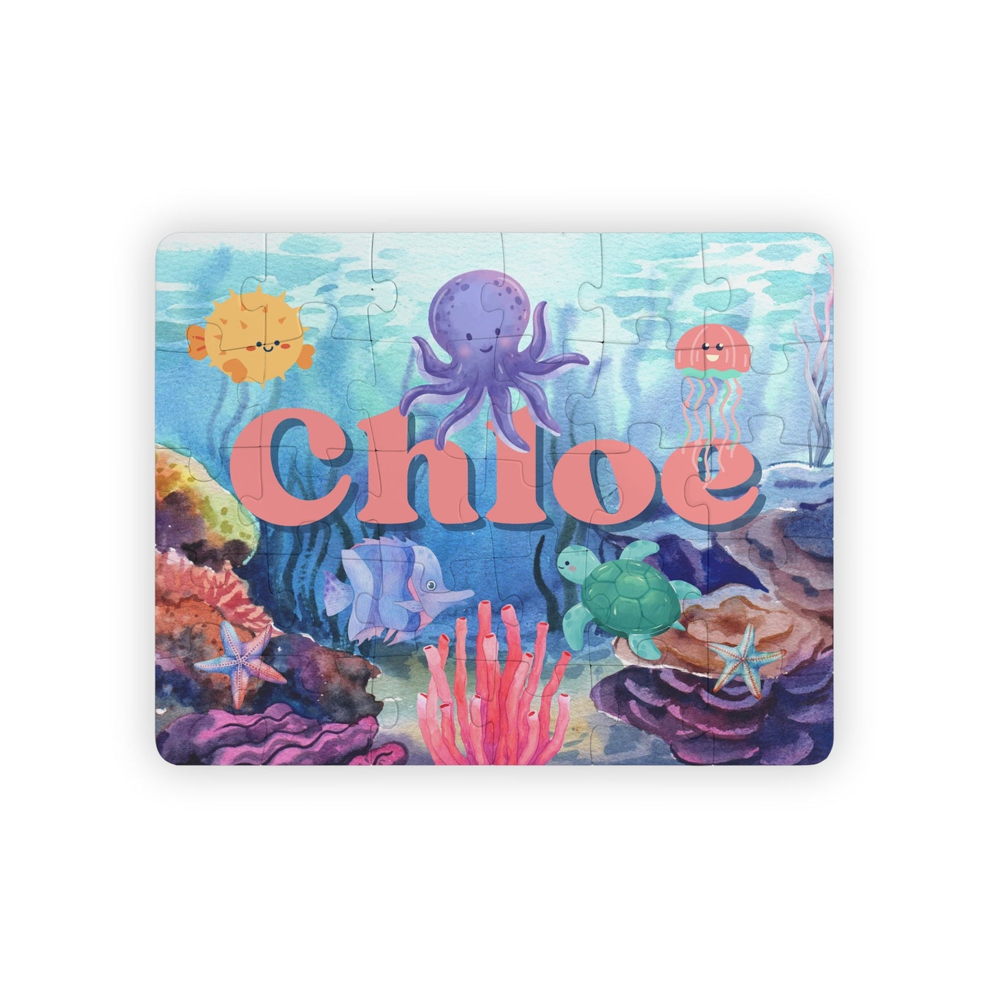 Personalized underwater name puzzle for kids featuring a colorful ocean scene with smiling octopus, jellyfish, turtle, tropical fish, coral reef, and starfish, custom child name displayed across the center on a 30-piece jigsaw puzzle