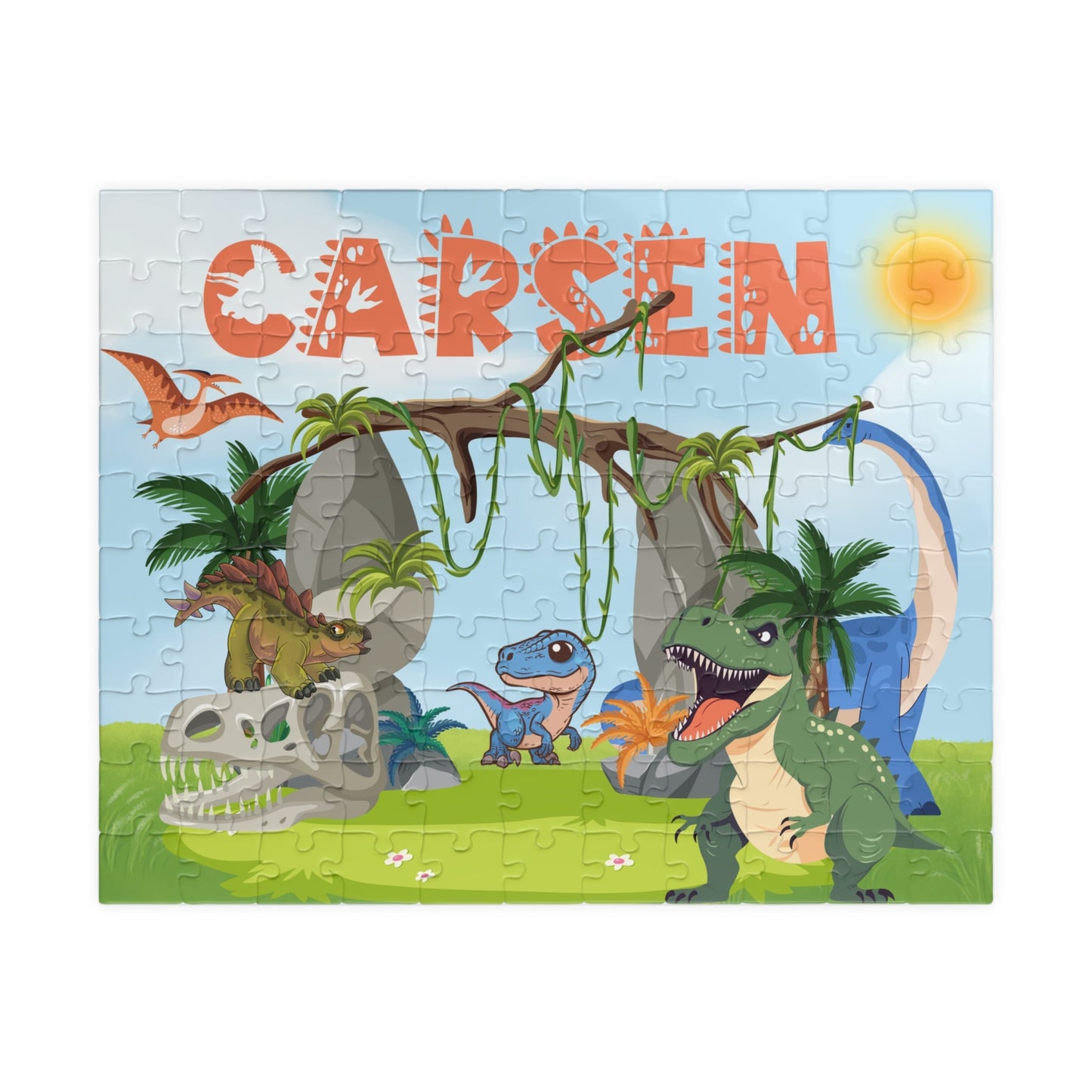 Personalized 110-piece dinosaur jigsaw puzzle for kids featuring a colorful Jurassic scene with multiple cartoon dinosaurs. The child’s name is custom printed at the top of the puzzle, making it a fun and personalized name puzzle gift.