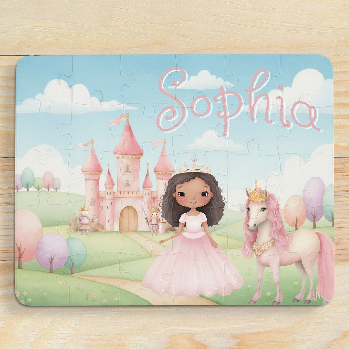 Personalized princess castle jigsaw puzzle with a customizable name printed across the top, featuring a princess character, pink castle, and unicorn in a pastel storybook scene