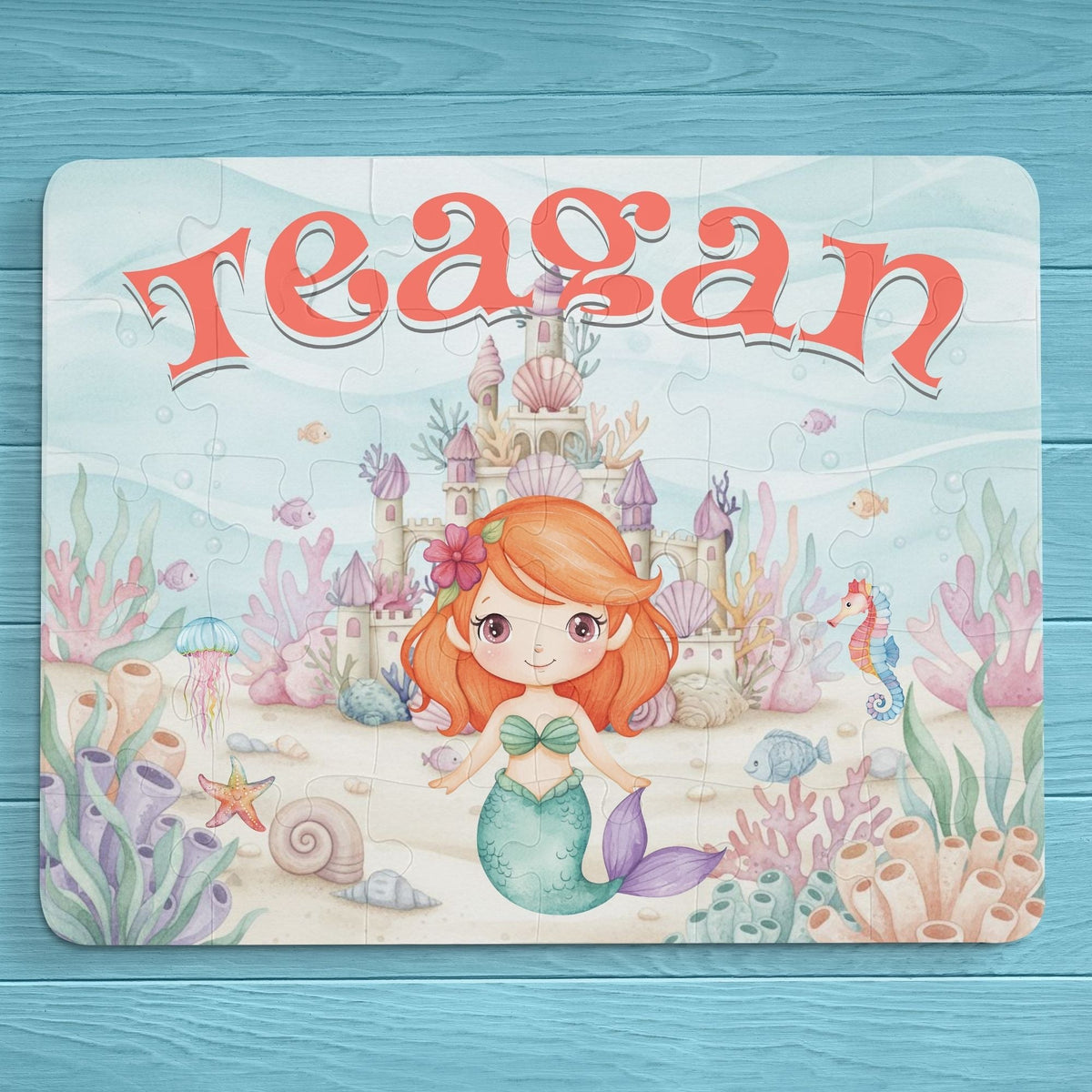 Personalized mermaid puzzle for kids featuring a smiling mermaid in an underwater castle scene with coral, shells, and sea creatures, customized with the child’s name displayed across the top
