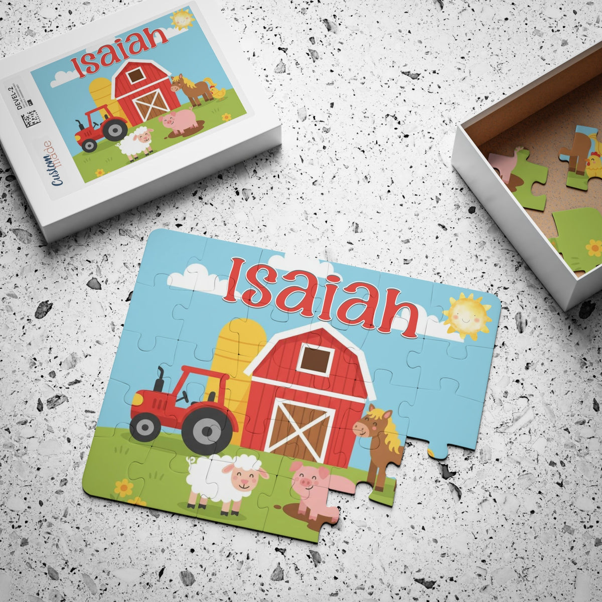 Personalized farm animal kids puzzle shown assembled and on the product box, featuring a barnyard scene with a tractor and animals, and a customizable child’s name displayed across the top.
