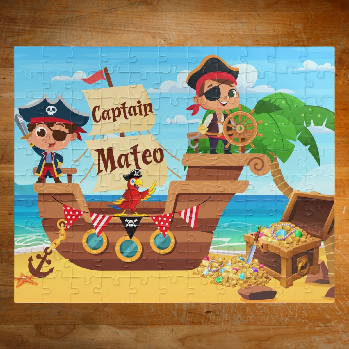 Personalized pirate ship name puzzle for kids featuring two cute cartoon pirates on a wooden ship with a parrot, ocean background, palm tree, and treasure chest filled with gold coins. The child’s name is customizable and appears on the sail of the ship (shown as “Captain Mateo”), making this a custom 110-piece jigsaw puzzle designed for children.