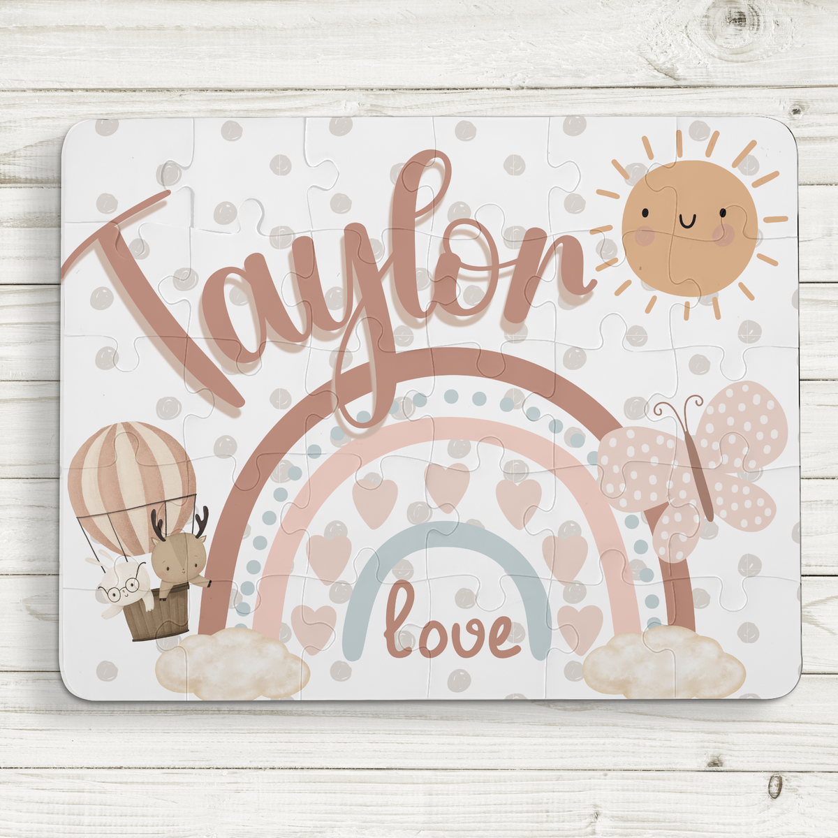 Boho rainbow themed personalized name puzzle for kids, showing a 30-piece jigsaw with a customizable child’s name printed across the top of the puzzle design.