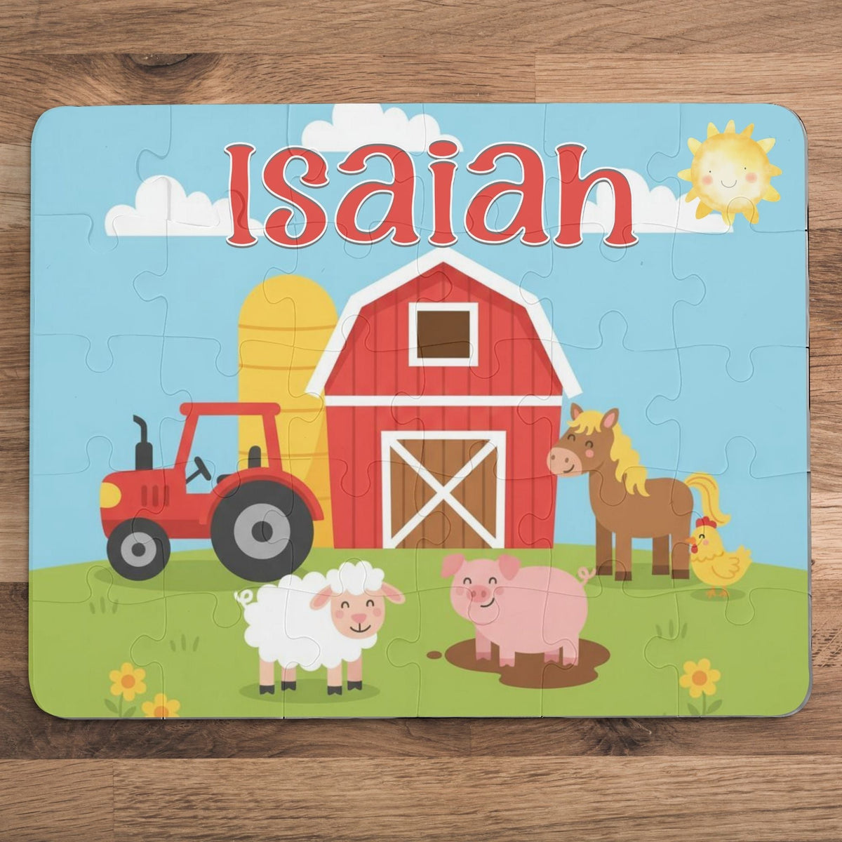 Personalized kids farm animal puzzle showing a colorful barnyard scene with a barn, tractor, horse, pig, sheep, and chicken, featuring a customizable child’s name displayed across the top of the puzzle.