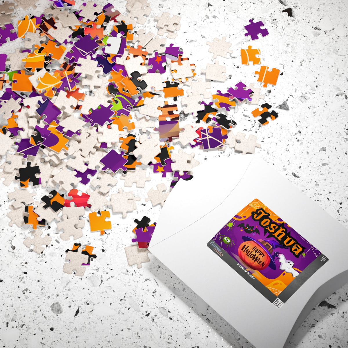 Personalized Halloween kids jigsaw puzzle shown with its matching gift box, featuring a customizable name on the puzzle design and a spooky pumpkin, ghost, and bat theme.