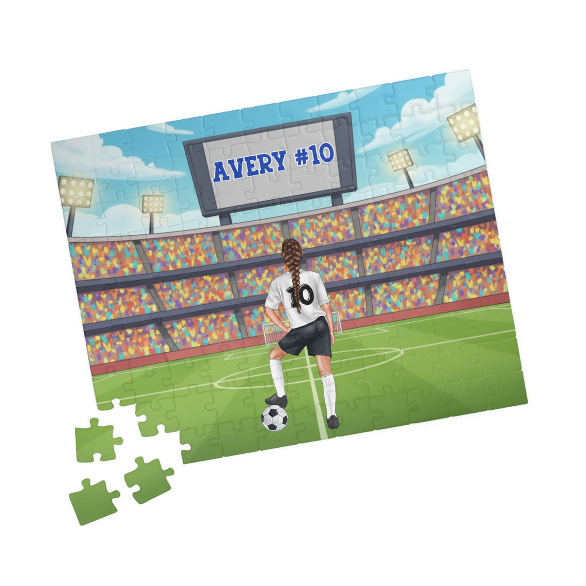 Angled view of a personalized girls soccer jigsaw puzzle with a stadium background, featuring a customizable name on the scoreboard and a customizable number on the jersey, with several jigsaw pieces displayed beside the puzzle.