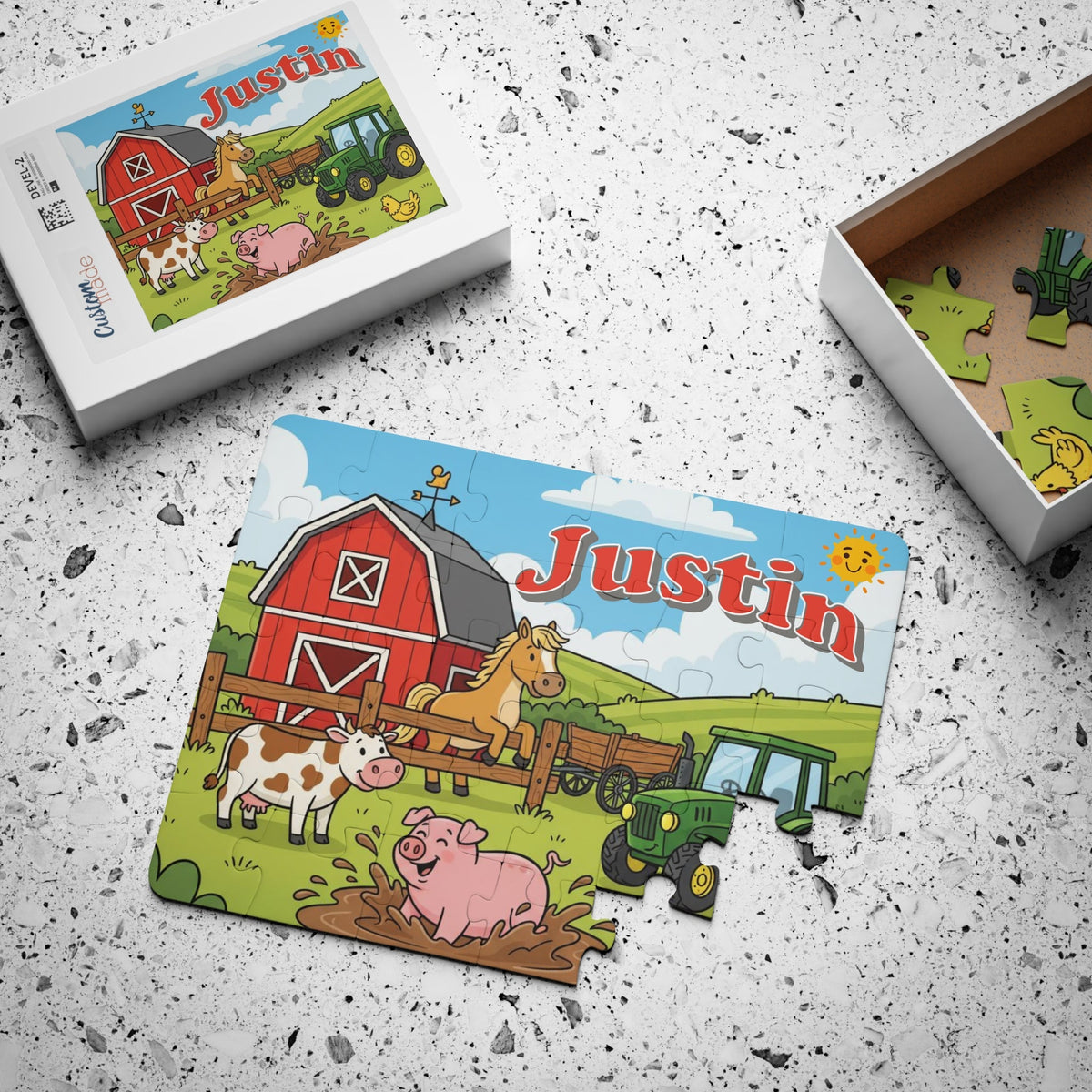 Custom name kids jigsaw puzzle with a colorful farm scene, shown next to its box and loose jigsaw pieces. The child’s name is customizable and printed across the top of the puzzle.