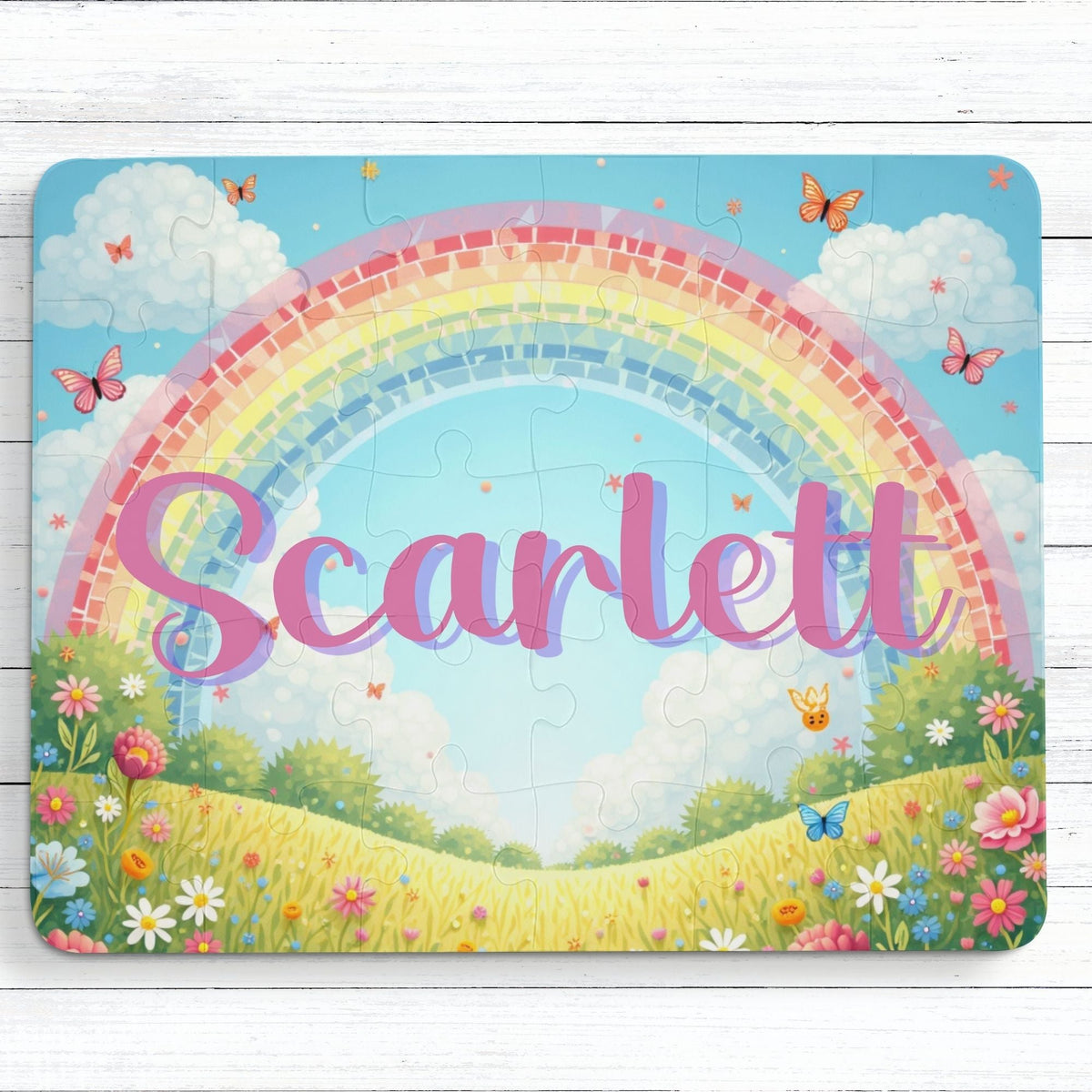 Personalized kids name puzzle featuring a colorful butterfly and rainbow design, with a customizable name displayed across the center of a 30-piece jigsaw puzzle.