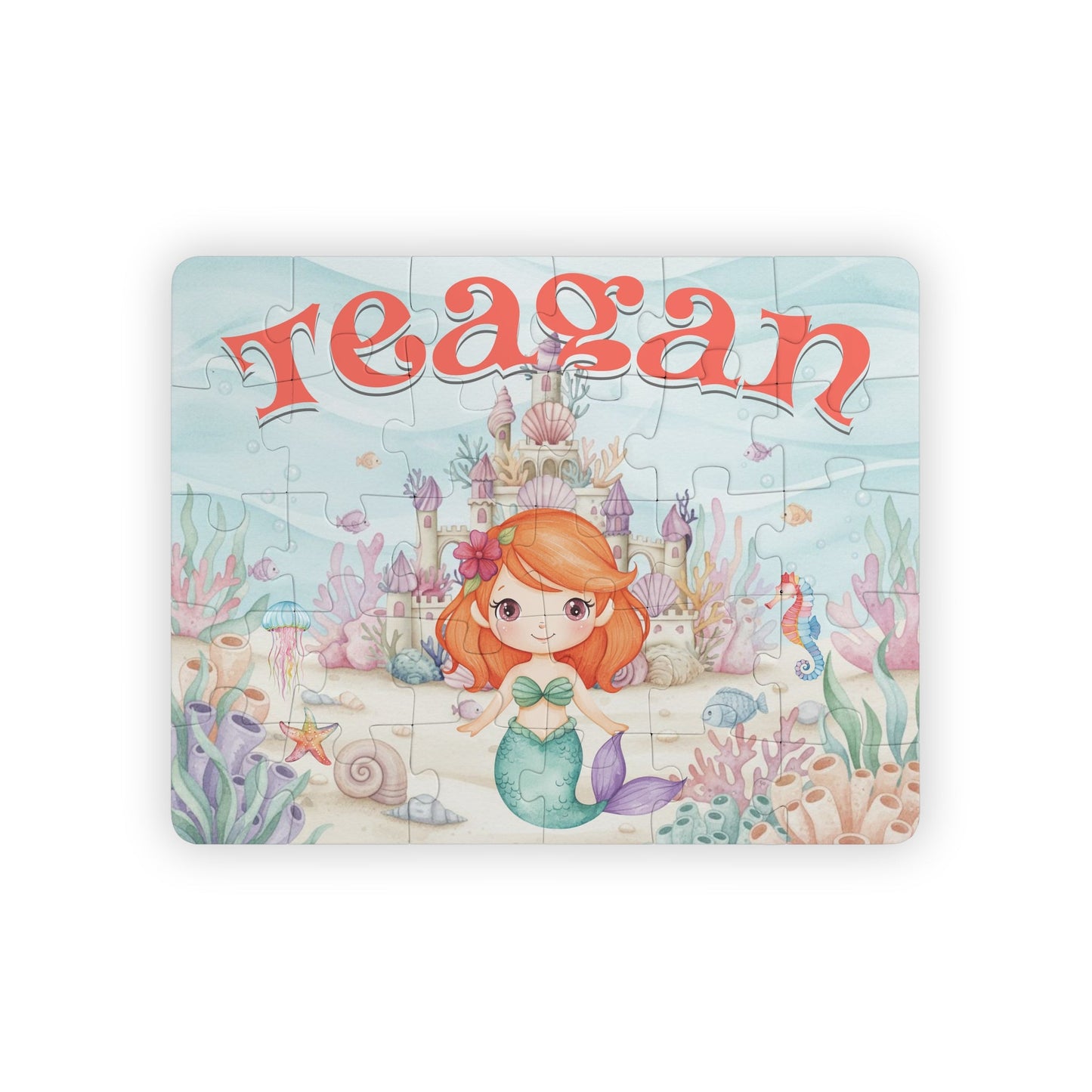 Personalized mermaid puzzle for kids featuring a smiling mermaid in an underwater castle scene with coral, shells, and sea creatures, customized with the child’s name displayed across the top