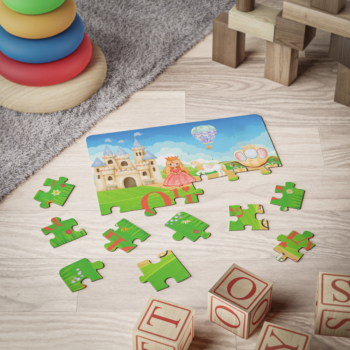 30-piece personalized kids princess jigsaw puzzle shown during playtime, with a customizable child’s name printed on the puzzle and jigsaw pieces scattered on the floor.