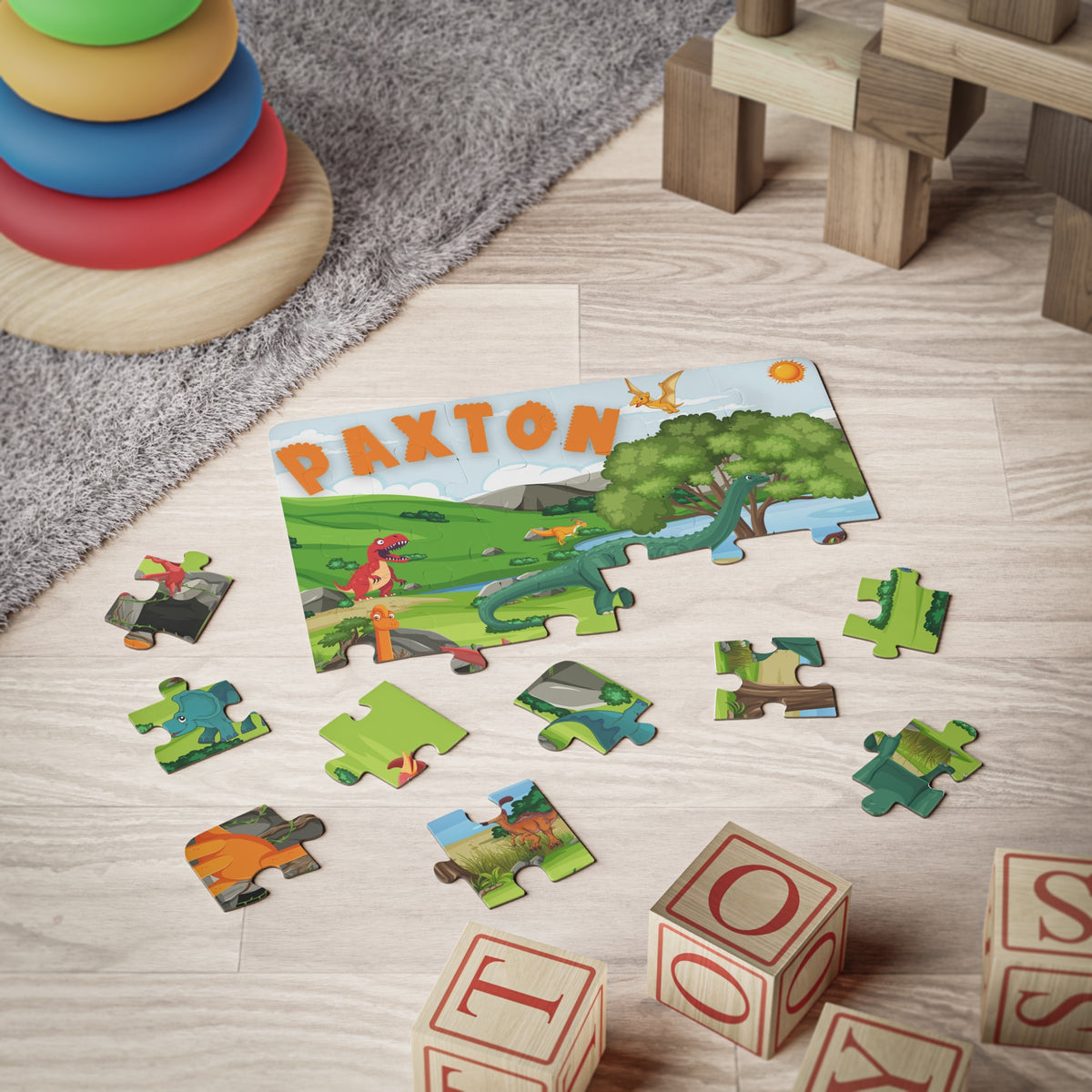 Child’s personalized dinosaur puzzle in use on a playroom floor, showing large easy-grip pieces and custom name at the top, designed for early learning and fine motor skills