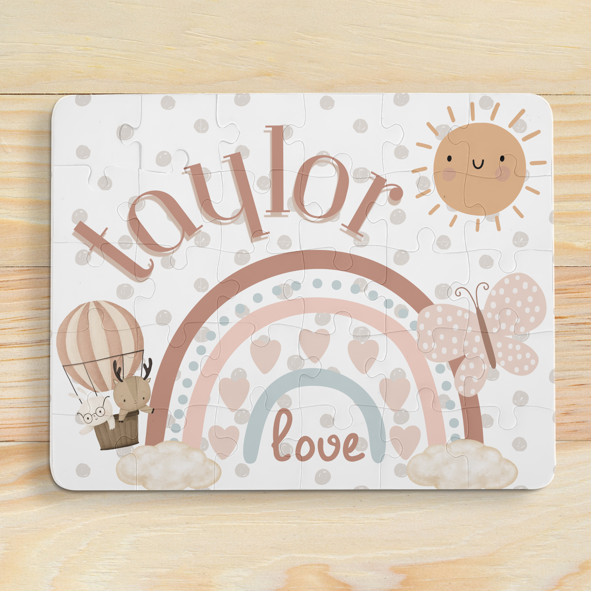 Boho rainbow themed personalized name puzzle for kids, showing a 30-piece jigsaw with a customizable child’s name printed across the top of the puzzle design.