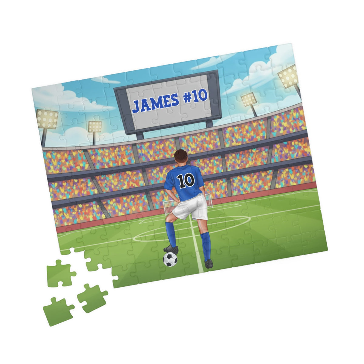 Angled view of a personalized boys soccer jigsaw puzzle showing a stadium background with a customizable name and number on the scoreboard and a customizable number on the player’s jersey.