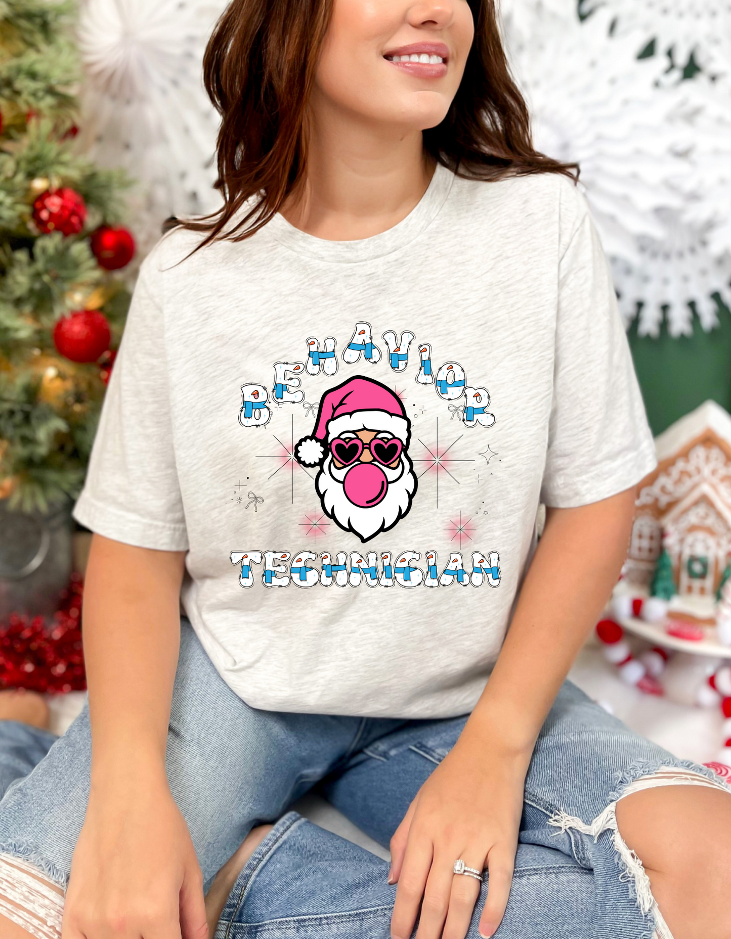 Funny Christmas themed Behavior Technician Unisex T shirt that features a Santa wearing sunglasses and blowing bubblegum bubbles and says "Behavior Technician" comes in a variety of sizes and colors