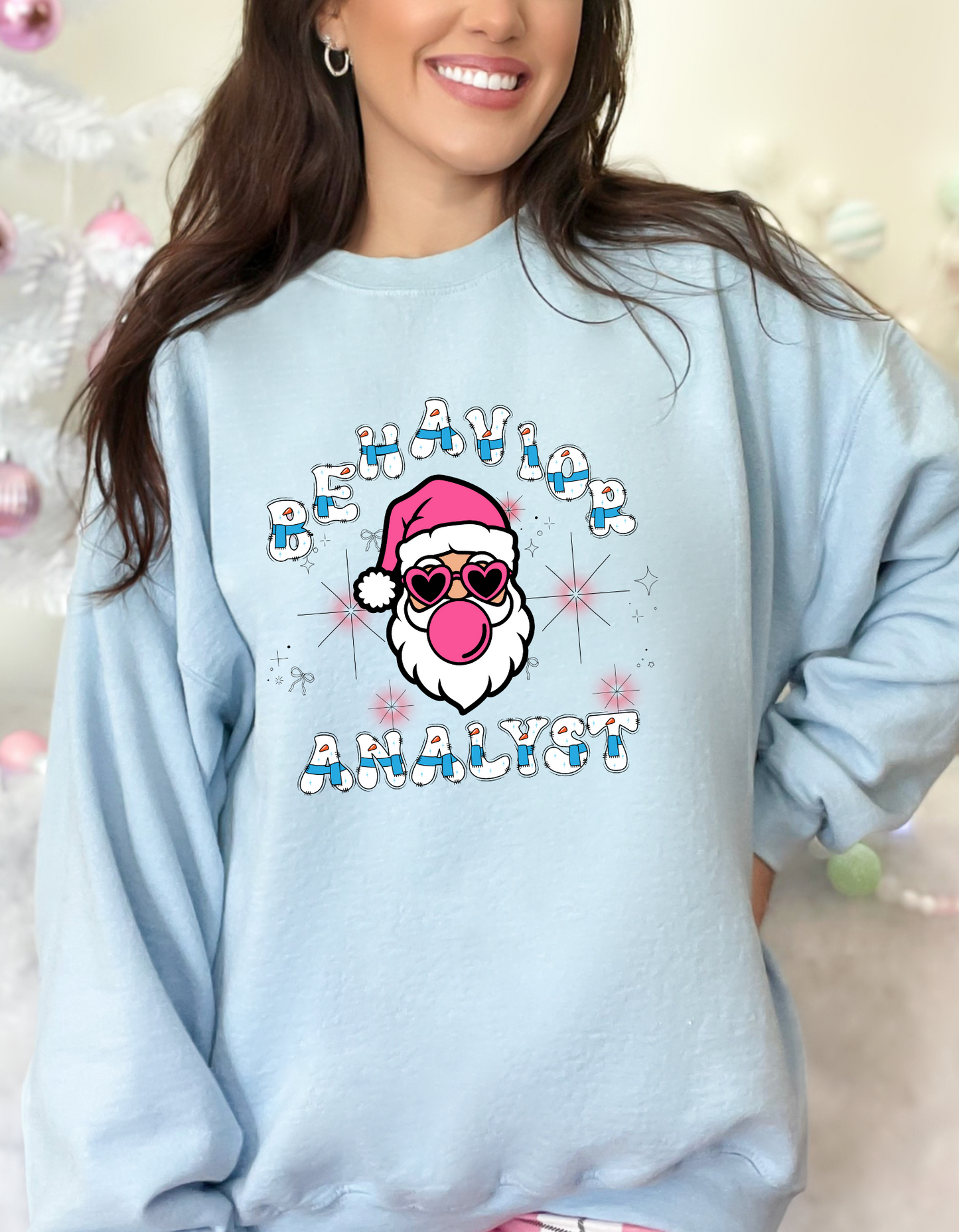 Funny Christmas sweater for behavior analyst. Has a Santa wearing glasses and blowing bubblegum bubbles that says Behavior Analyst. Perfect festive sweatshirt for self or as a gift for a behavior analyst