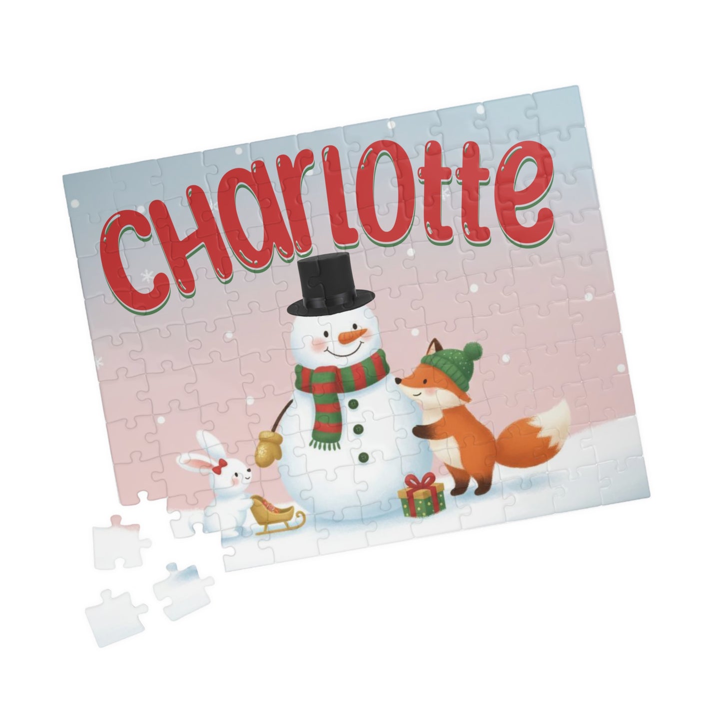 Angled view of a personalized snowman Christmas puzzle with a custom name and loose puzzle pieces beside the completed design.