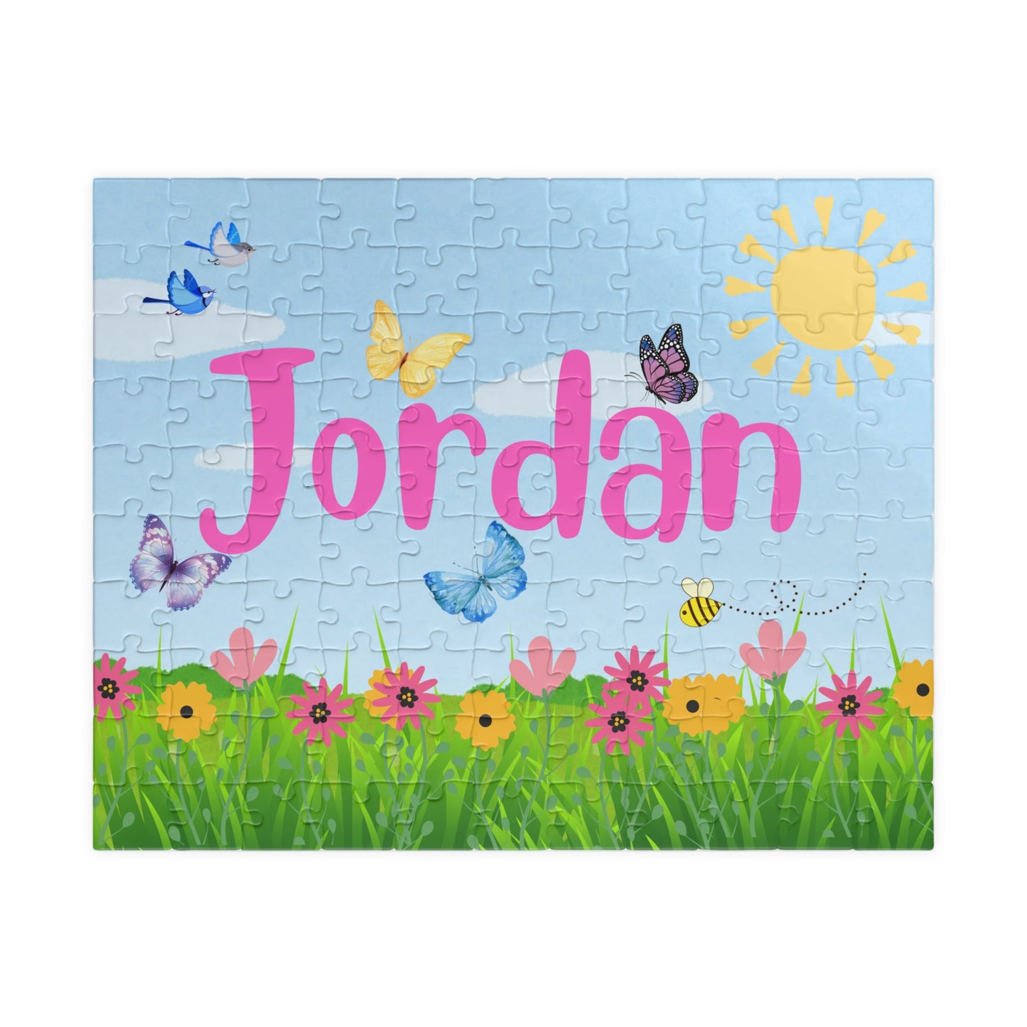 Personalized 110 piece spring themed jigsaw puzzle with a customizable name displayed across the center, featuring butterflies, birds, flowers, green grass, and a sunny sky