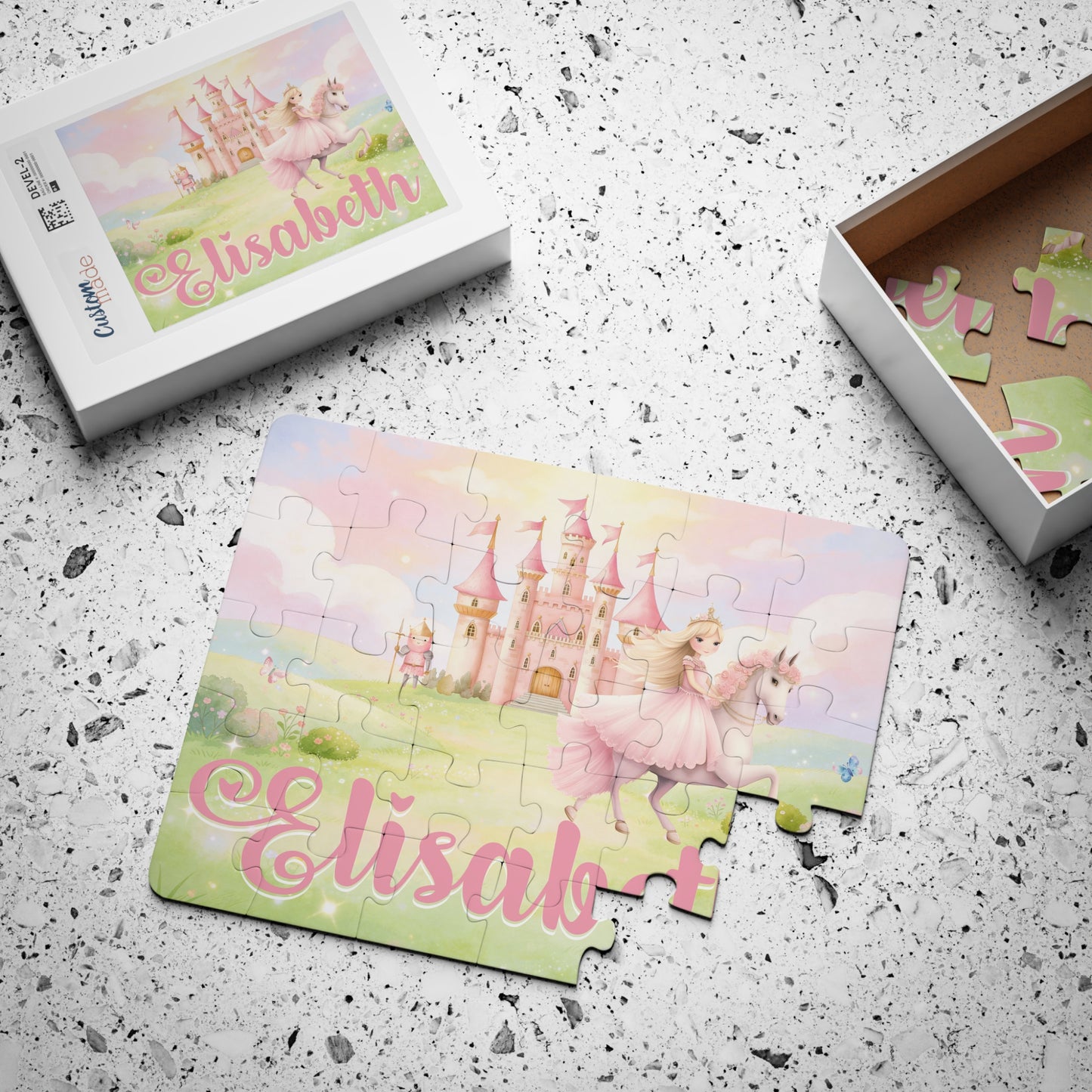 Large jigsaw puzzle pieces scattered on a surface beside packaging displaying a pastel princess horse and castle scene with a customizable child’s name on the box label.