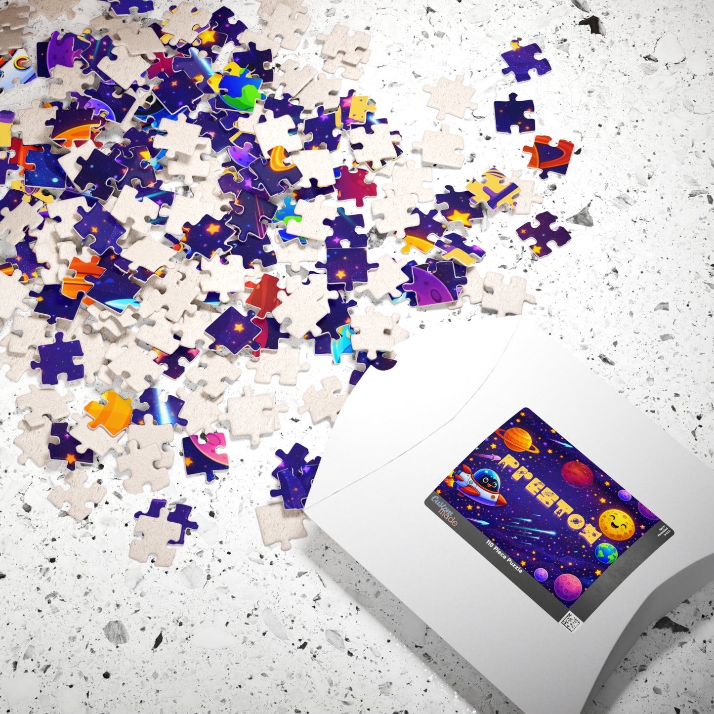 Completed personalized space puzzle with a custom name displayed beside its gift box, featuring planets, stars, rockets, Earth, and a colorful outer space theme for kids.