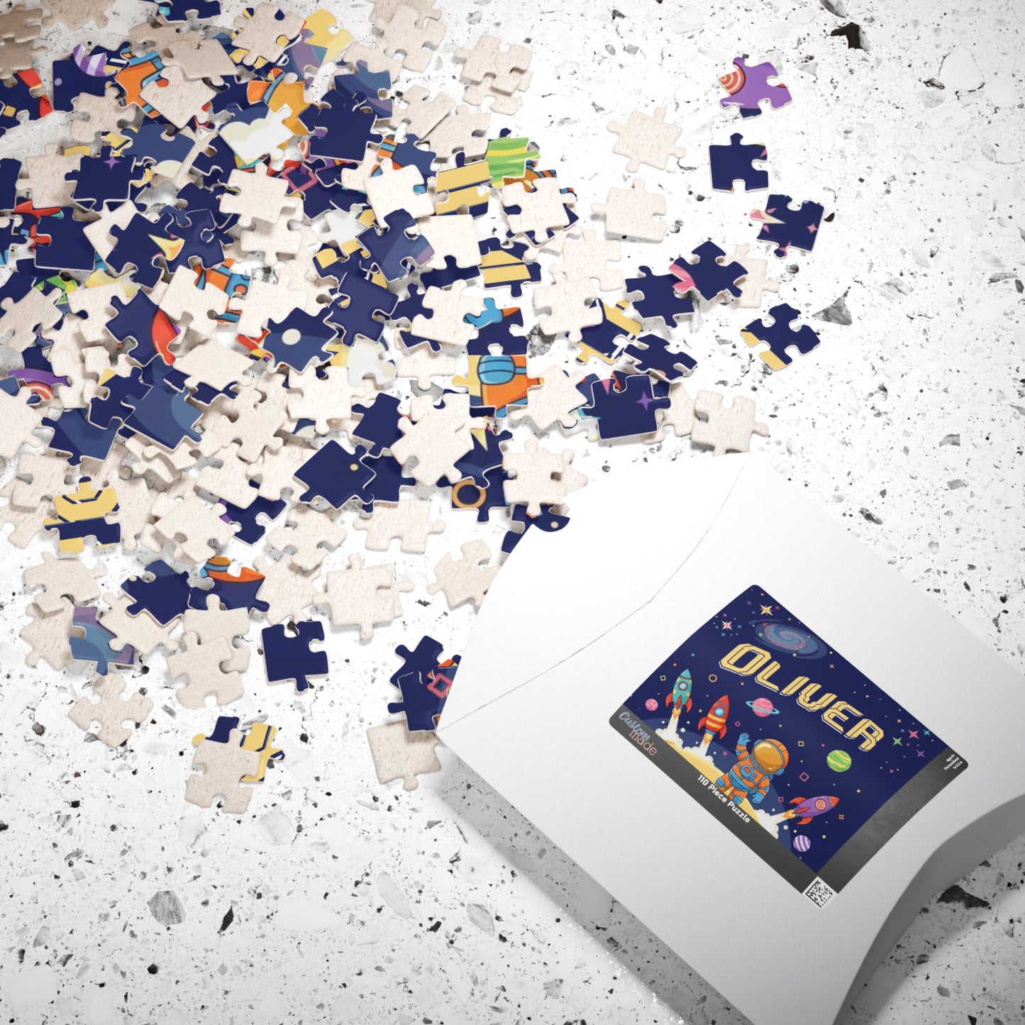 Personalized 110 piece space astronaut name puzzle shown with matching puzzle box, featuring a customizable name and outer space themed design