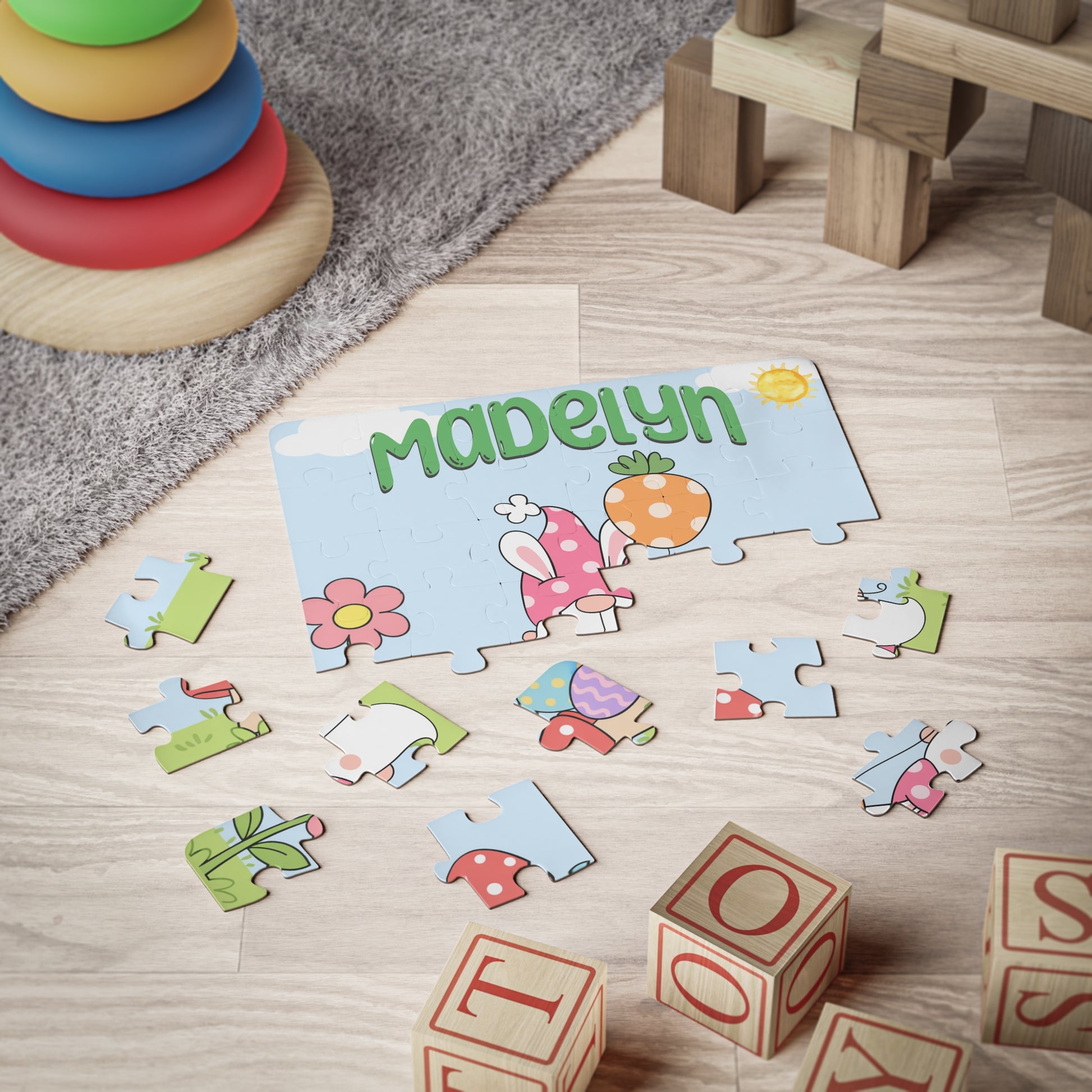 Custom Easter gnome puzzle displayed on the floor during playtime, showing scattered jigsaw pieces and a personalized name design. 30-piece kids puzzle with spring artwork.