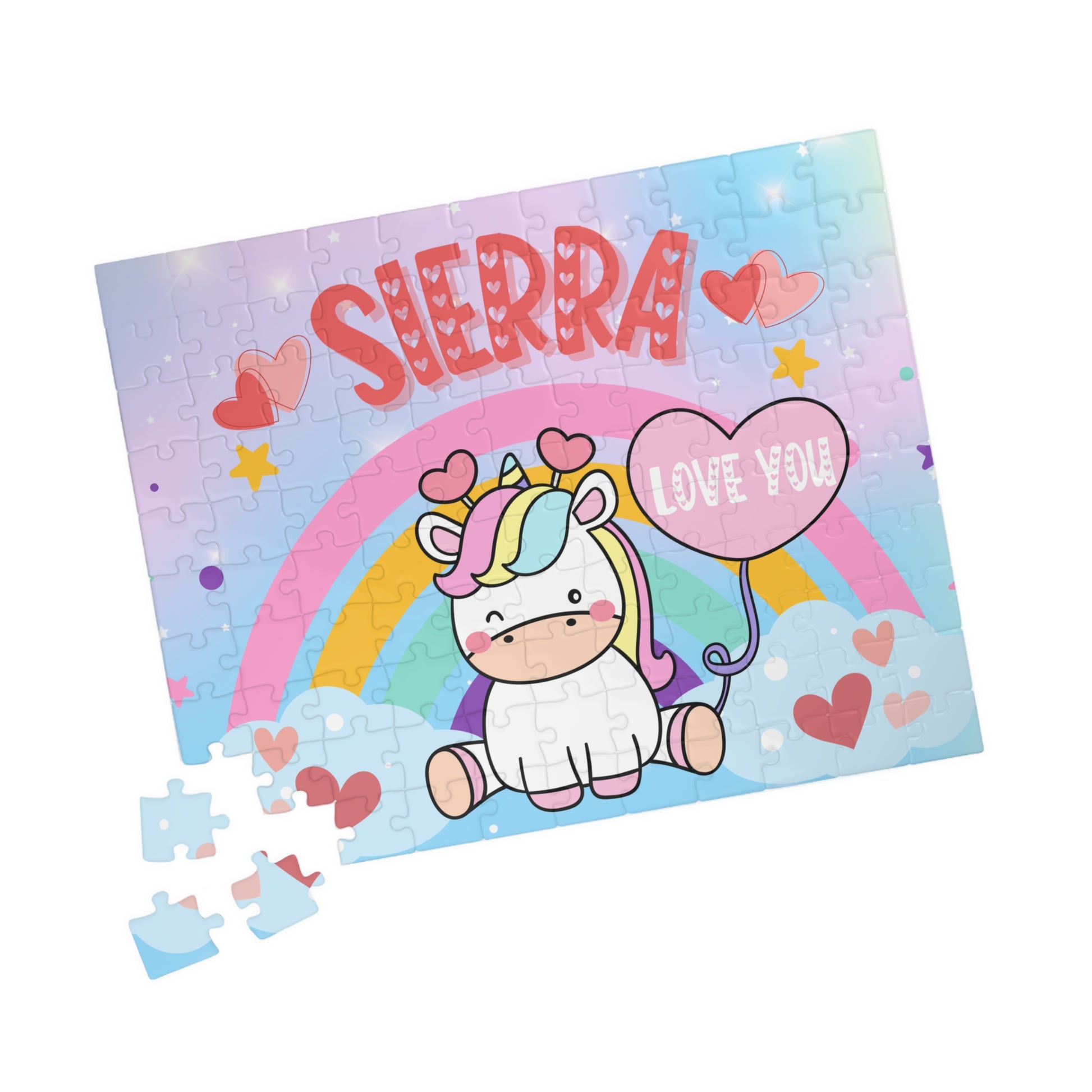 110-piece personalized unicorn rainbow puzzle featuring a winking unicorn, pastel rainbow background, floating hearts, and a customizable child’s name displayed across the top.