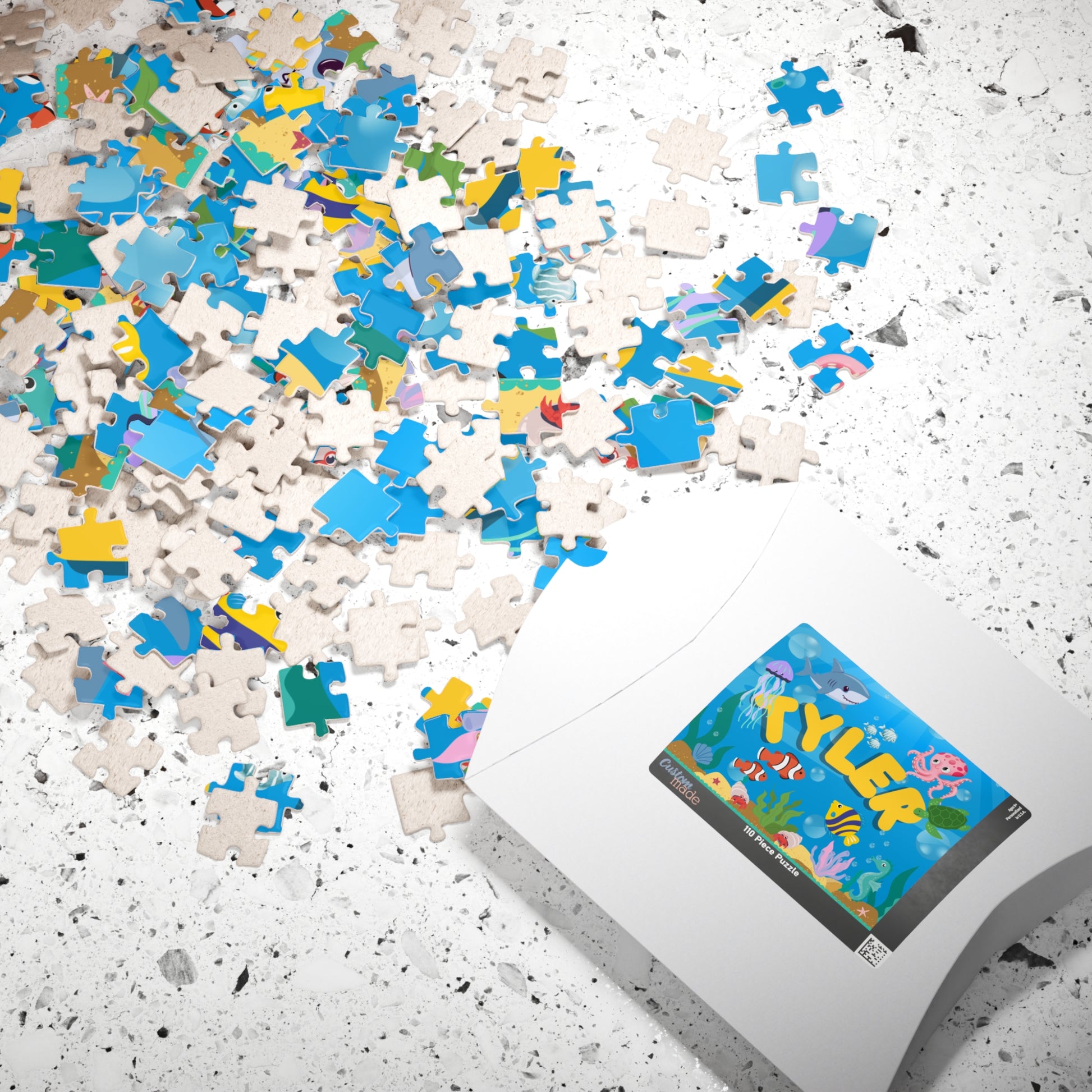 Personalized ocean-themed 110-piece puzzle with custom name shown alongside its matching puzzle box.