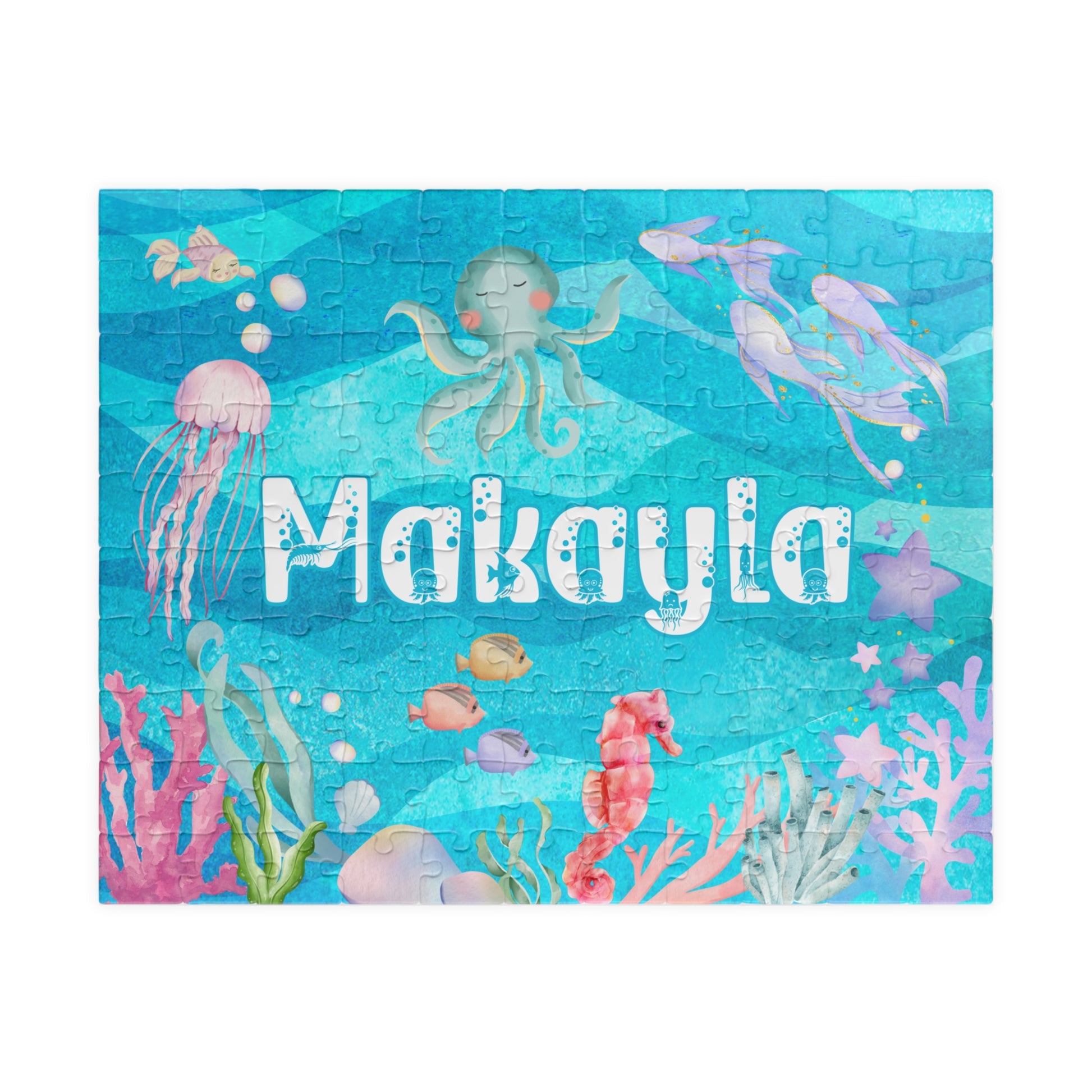 Personalized 110 piece ocean themed jigsaw puzzle featuring a customizable name centered in an underwater scene with sea animals, coral, and bubbles