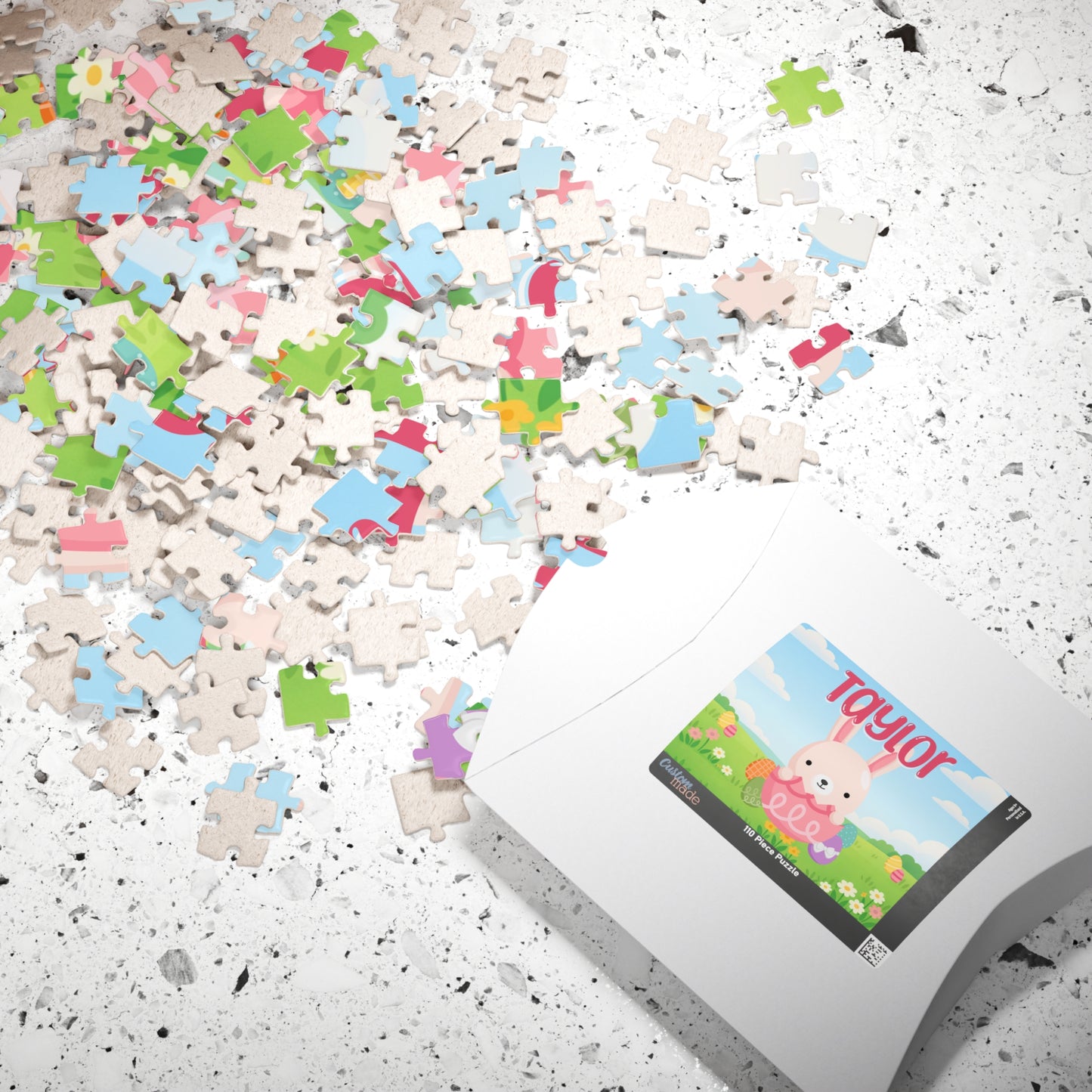 Personalized Easter bunny jigsaw puzzle with jigsaw pieces scattered beside the puzzle box, featuring a colorful spring bunny design and a customizable name printed on the puzzle.