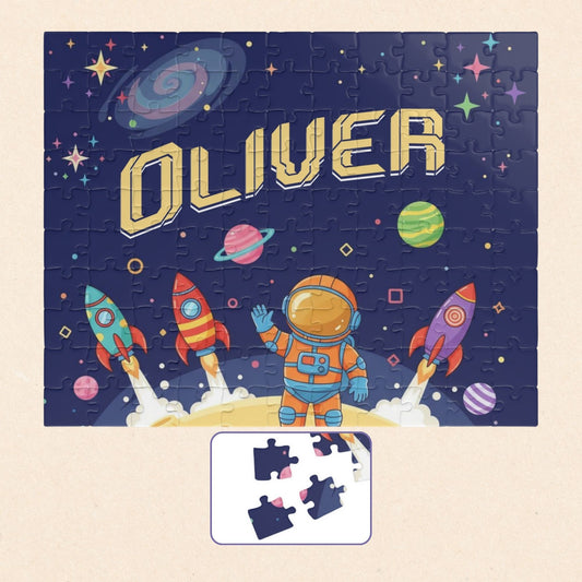 Personalized 110 piece space astronaut jigsaw puzzle featuring rockets, planets, and a cartoon astronaut, with a customizable name displayed across the center
