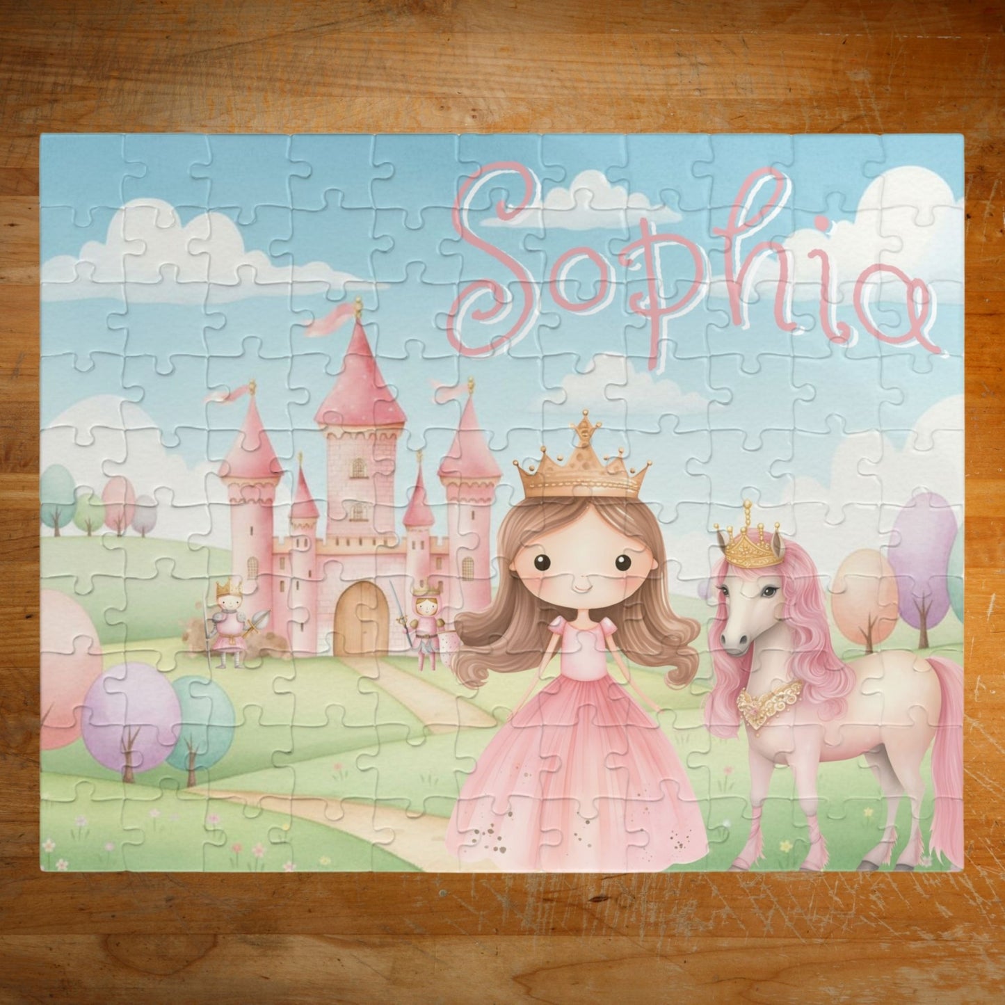Completed personalized princess puzzle featuring a pastel castle scene, princess character, horse, rolling hills, and a customizable child’s name displayed prominently across the top