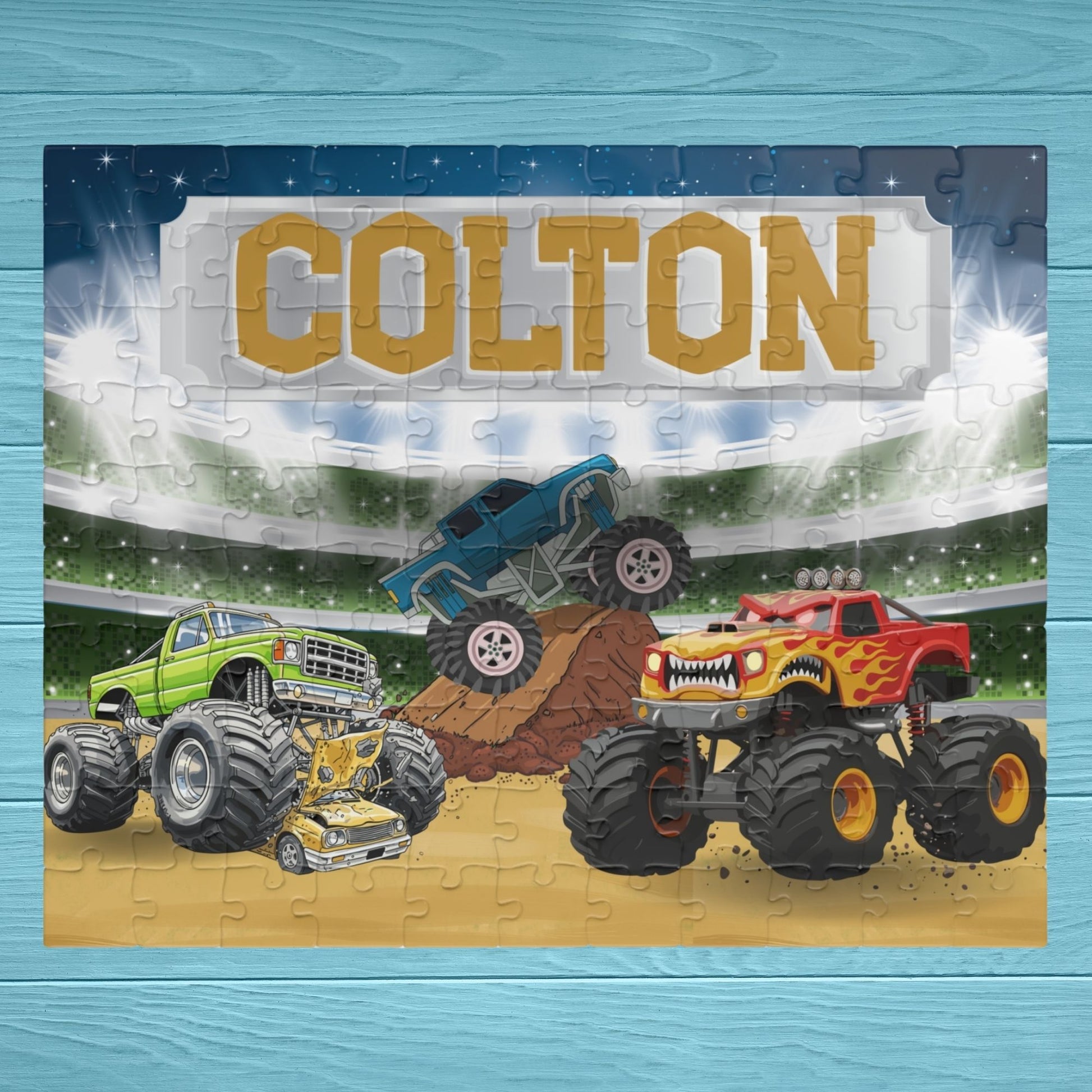 Personalized monster truck puzzle with customizable name displayed across the top, featuring a stadium scene with colorful trucks in action and bold, kid-friendly design.