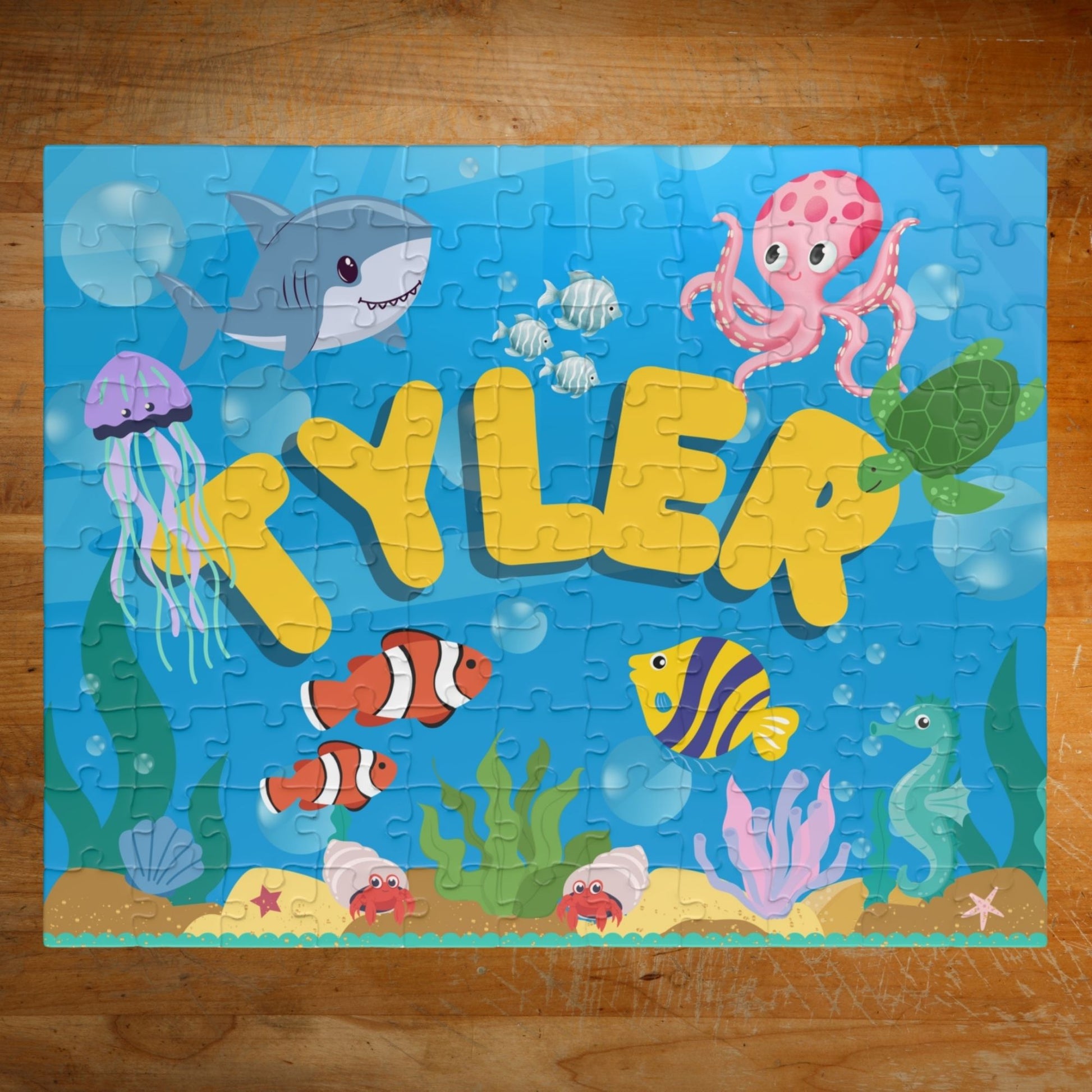 Personalized 110-piece ocean puzzle featuring an underwater scene with sea animals and a customizable name displayed in the center.