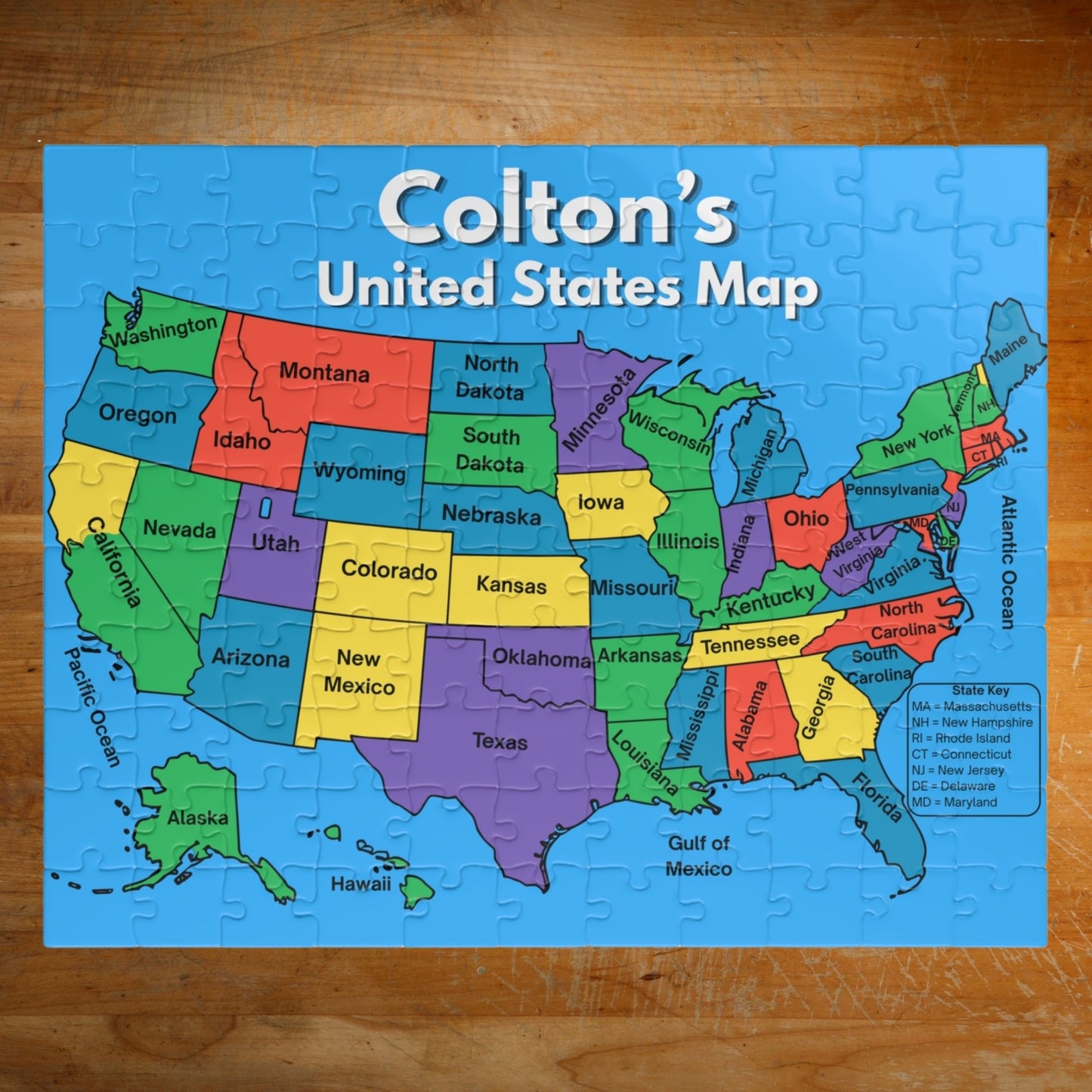 Personalized 110-piece United States map puzzle featuring a custom child's name above a colorful labeled map of all 50 states with bright educational design.