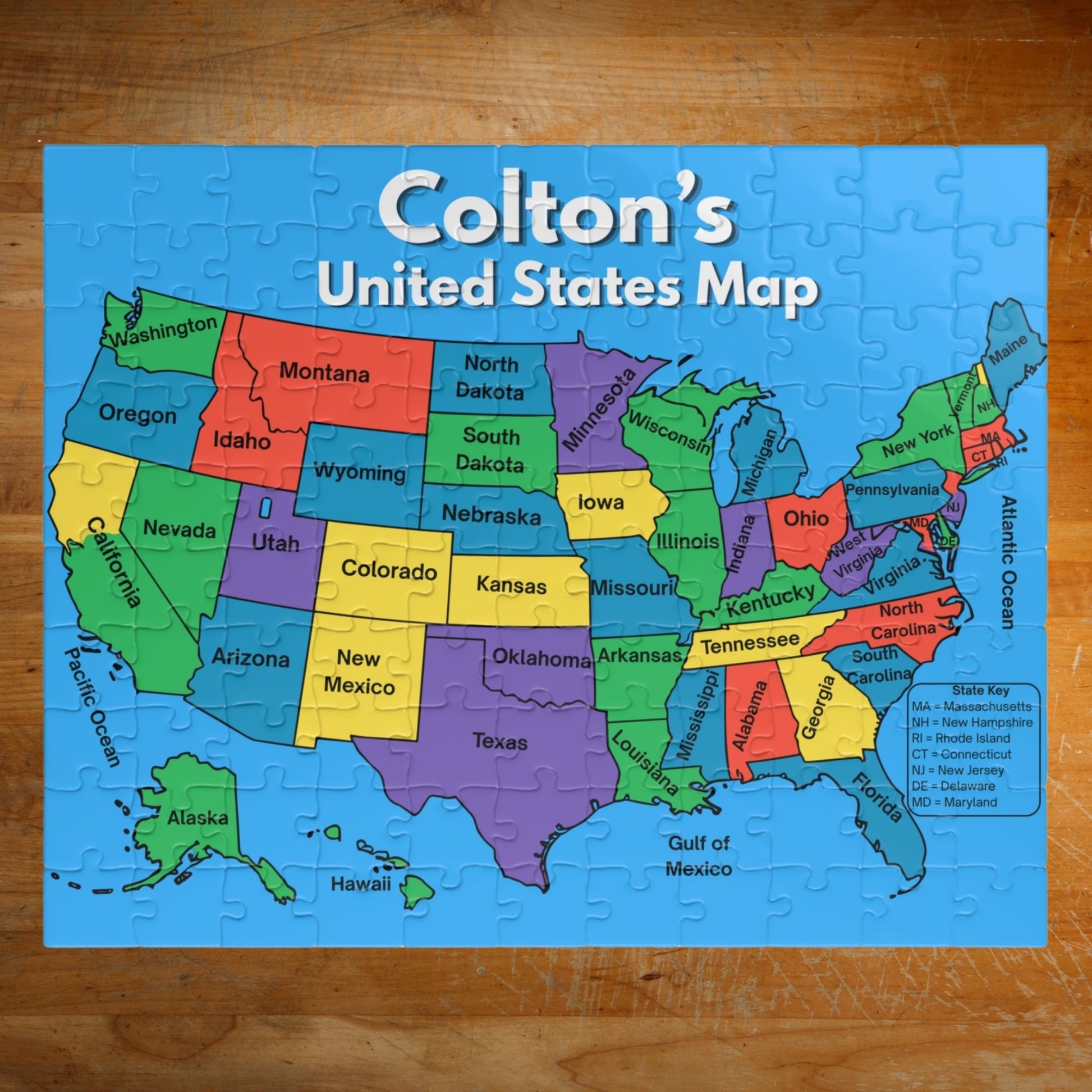 Personalized 110-piece United States map puzzle featuring a custom child's name above a colorful labeled map of all 50 states with bright educational design.