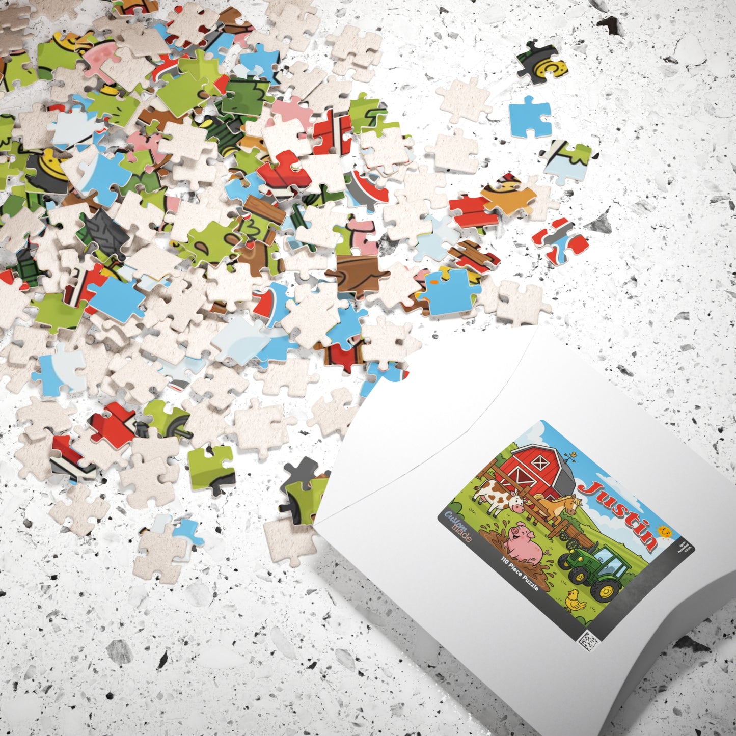 Scattered puzzle pieces beside packaging showing a colorful personalized farm animals puzzle featuring a barn, tractor, pig, cow, horse, chicken, and customizable child name.