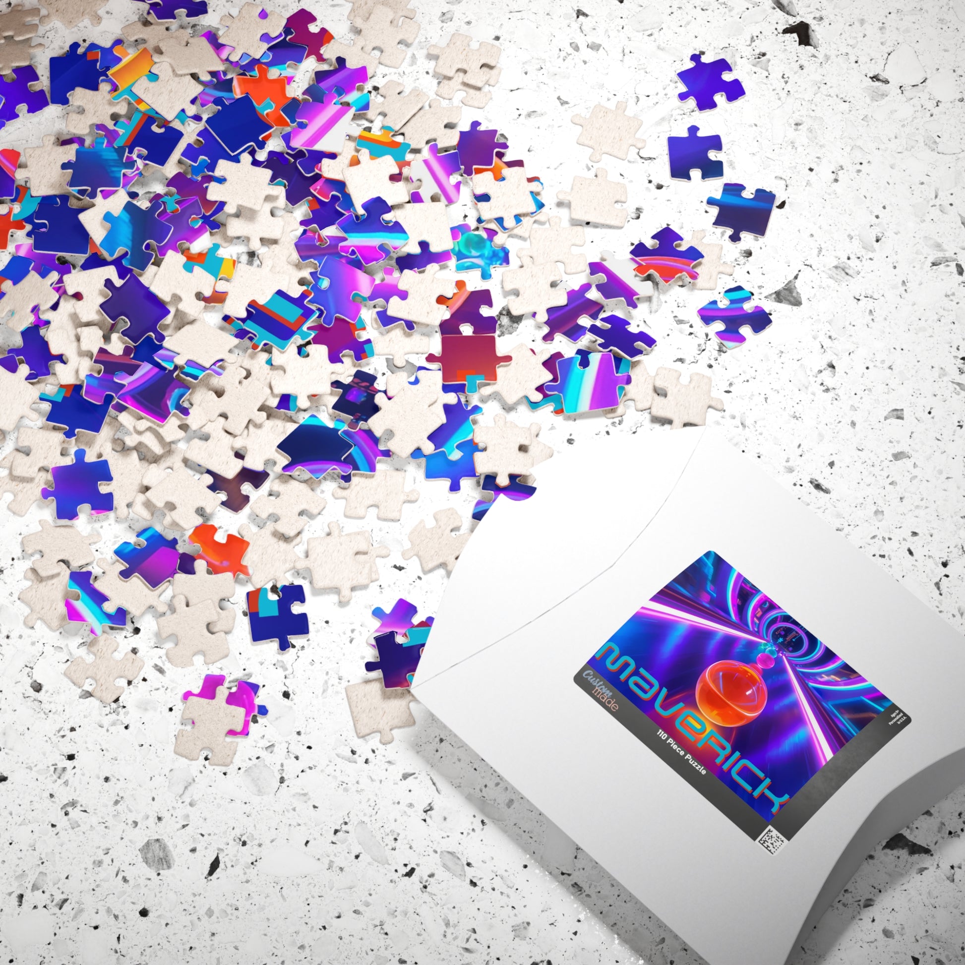 Scattered jigsaw pieces from a personalized neon marble race puzzle shown next to the puzzle box. The design features bright neon colors and a custom name included on the completed puzzle image.