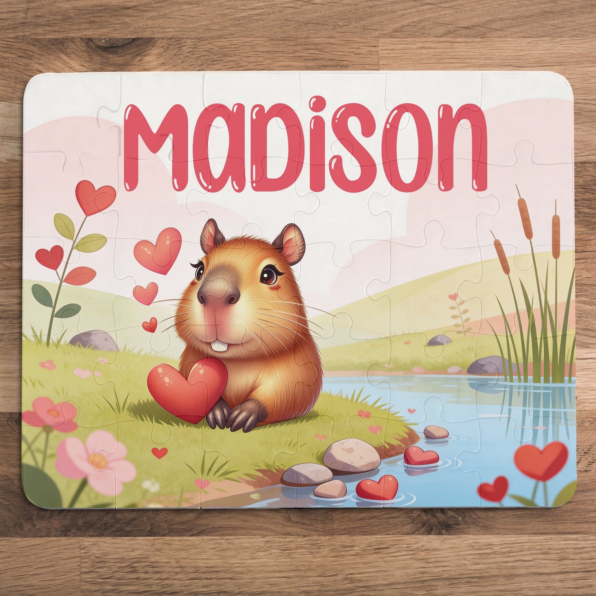 Personalized capybara puzzle for kids showing a cute capybara holding a heart beside a peaceful pond. This 30-piece custom name puzzle is designed for children, making it perfect for Valentine’s Day, birthdays, or everyday calm play. Soft colors, simple shapes, and an adorable animal theme create a meaningful keepsake and screen-free learning activity.