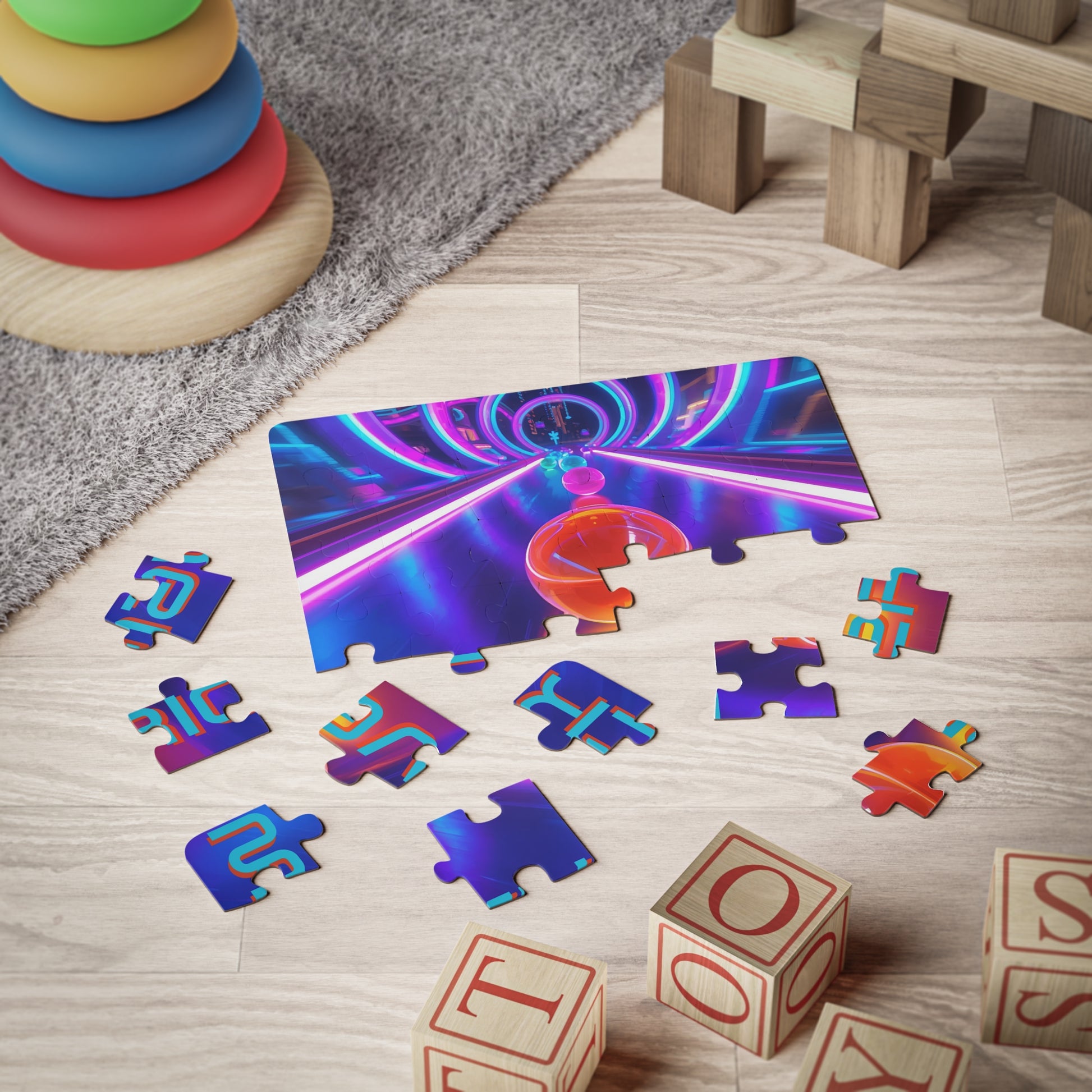 Personalized neon marble race 30-piece jigsaw puzzle shown partially assembled with large puzzle pieces on a playroom floor, featuring glowing tunnels and colorful marbles. Custom name appears across the puzzle design.